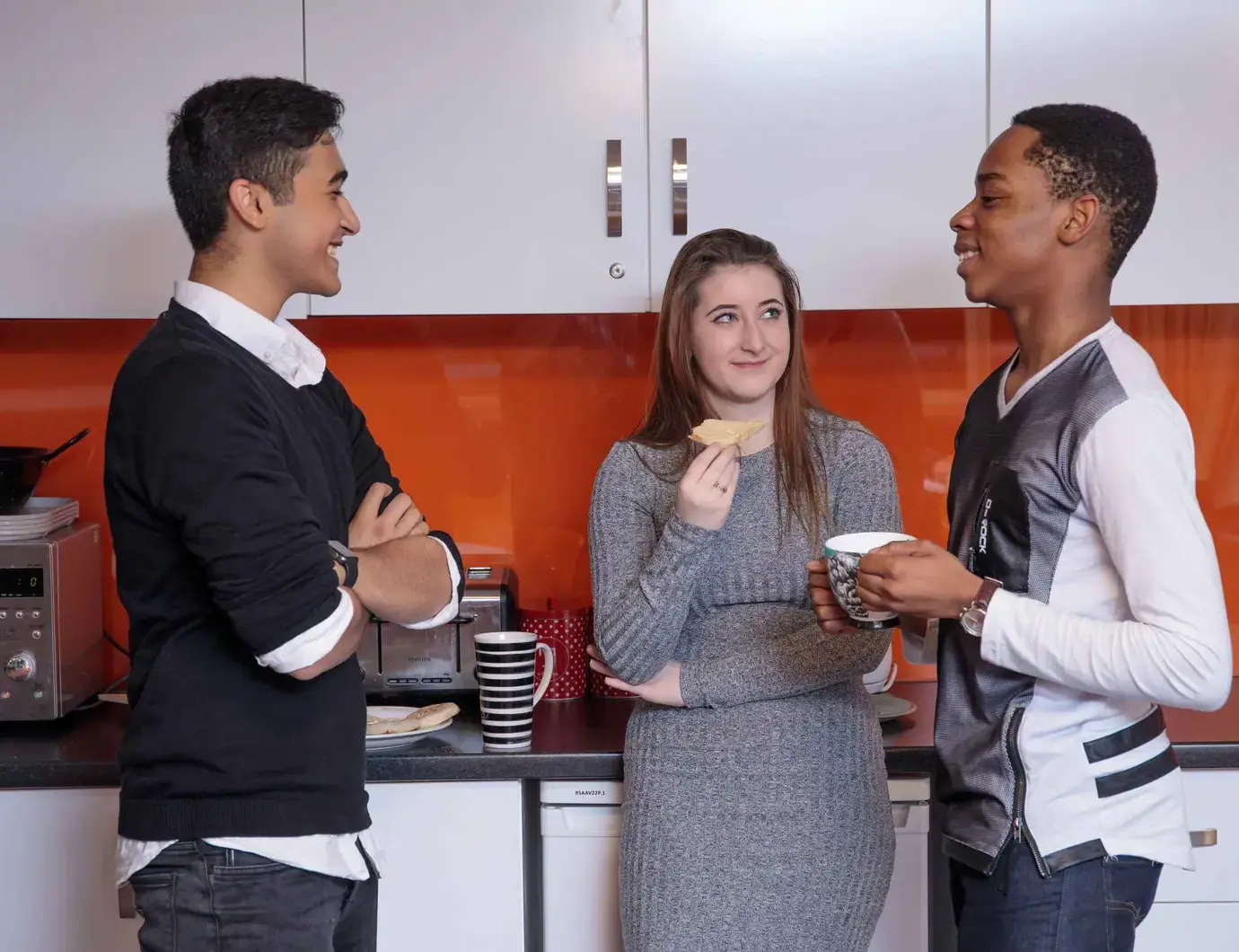 Students chatting in kitchen