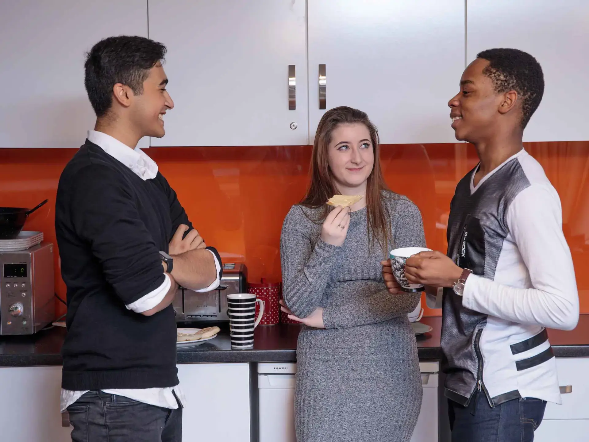 Students chatting in kitchen