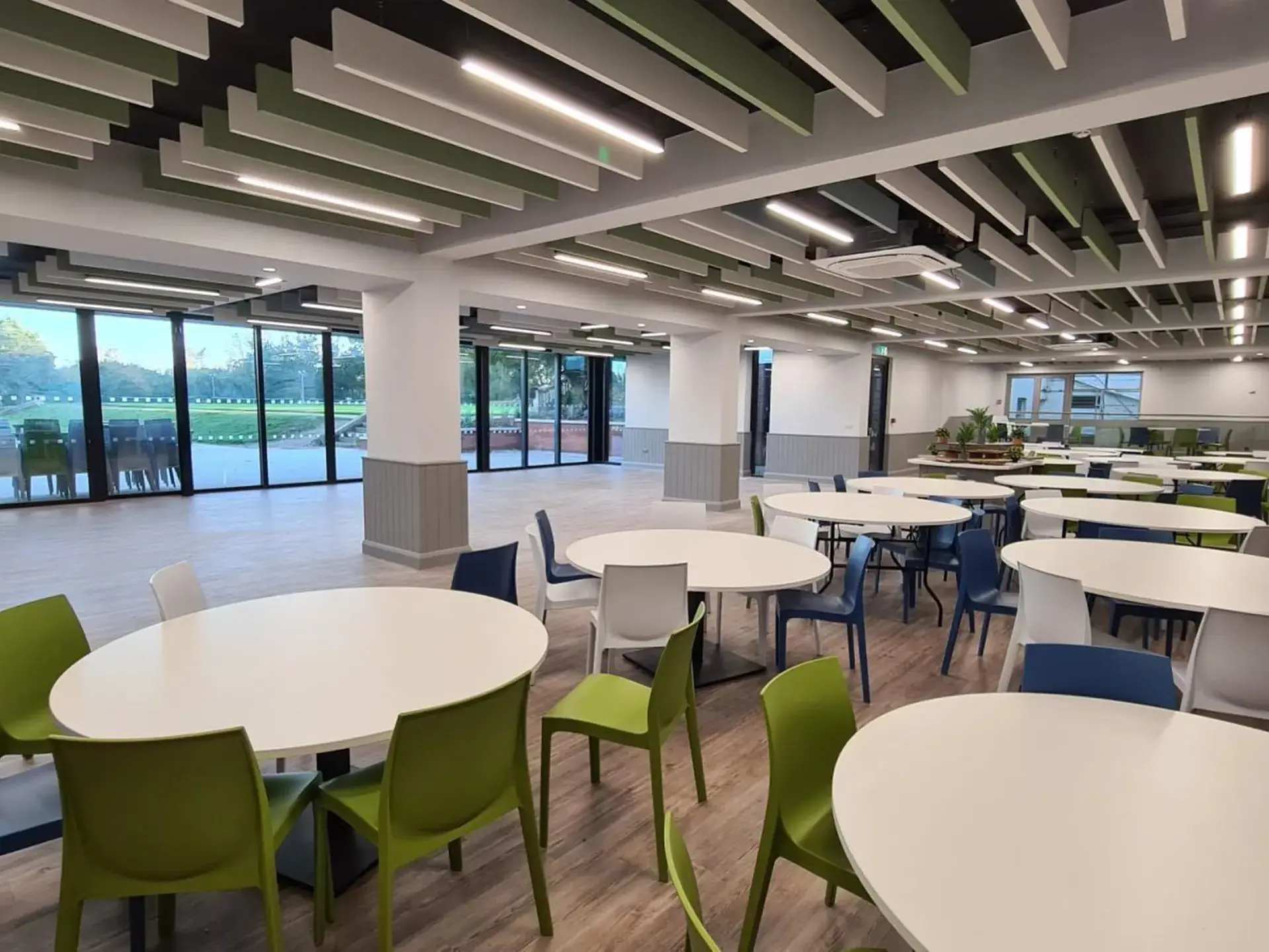 A large room with several tables and chairs set up