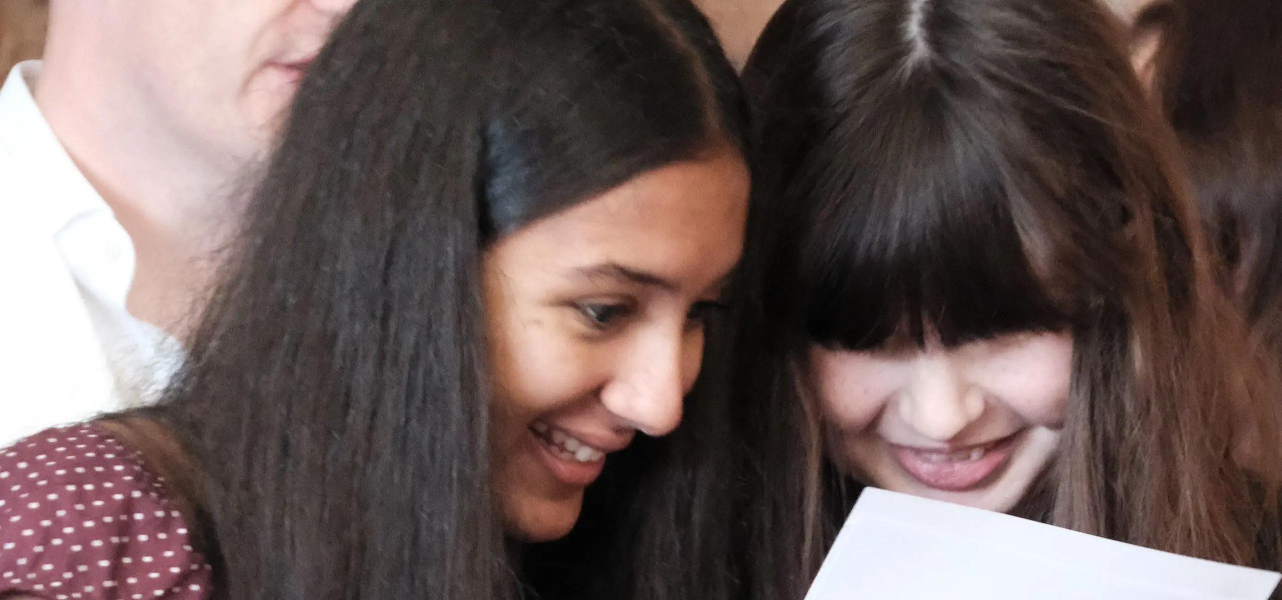 Students looking at results together