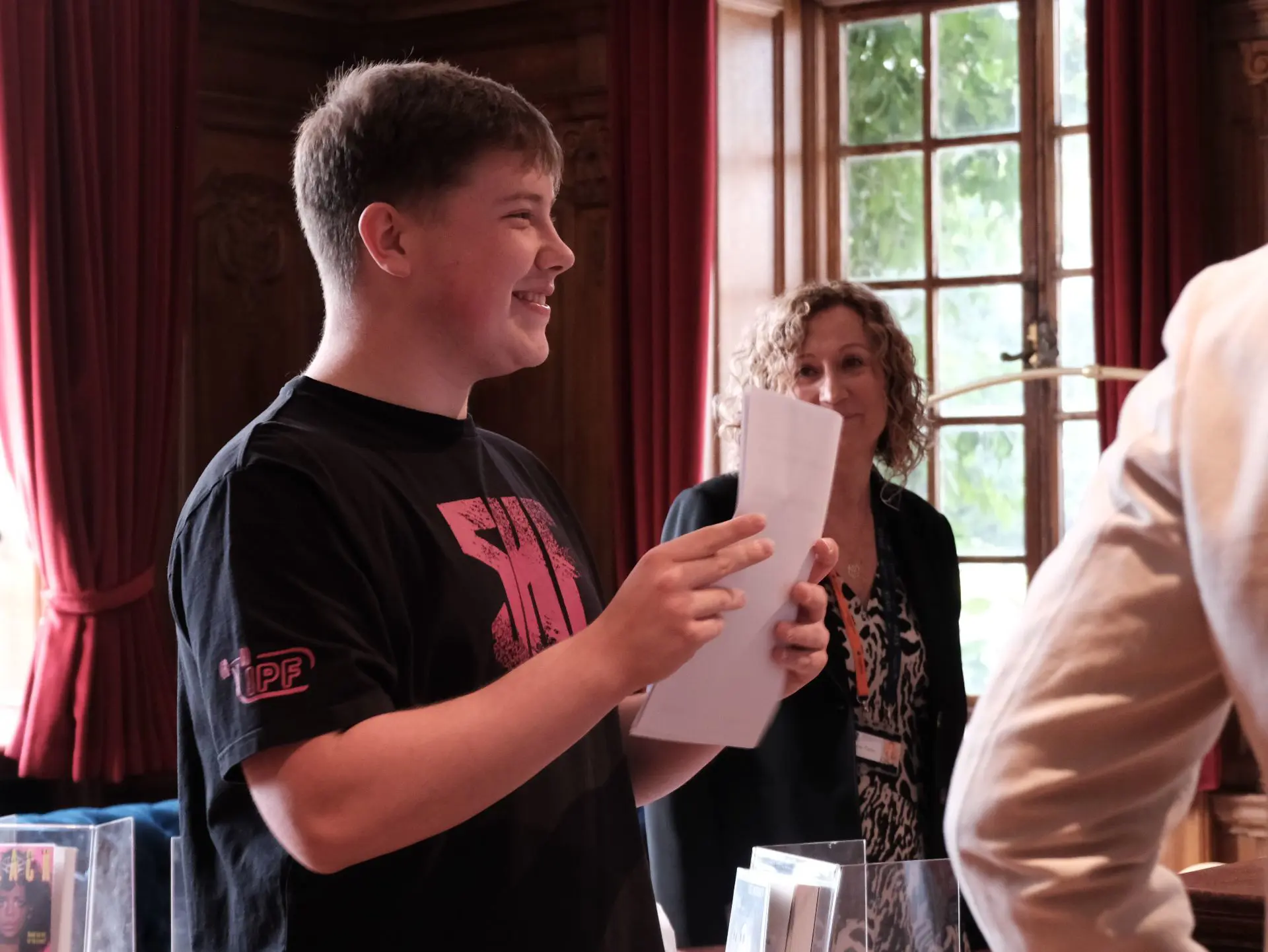 Student holding up results sheet