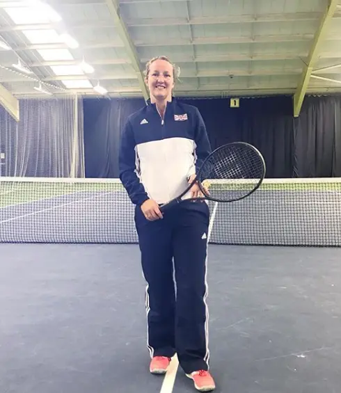 Debbie Hale holding a tennis racquet