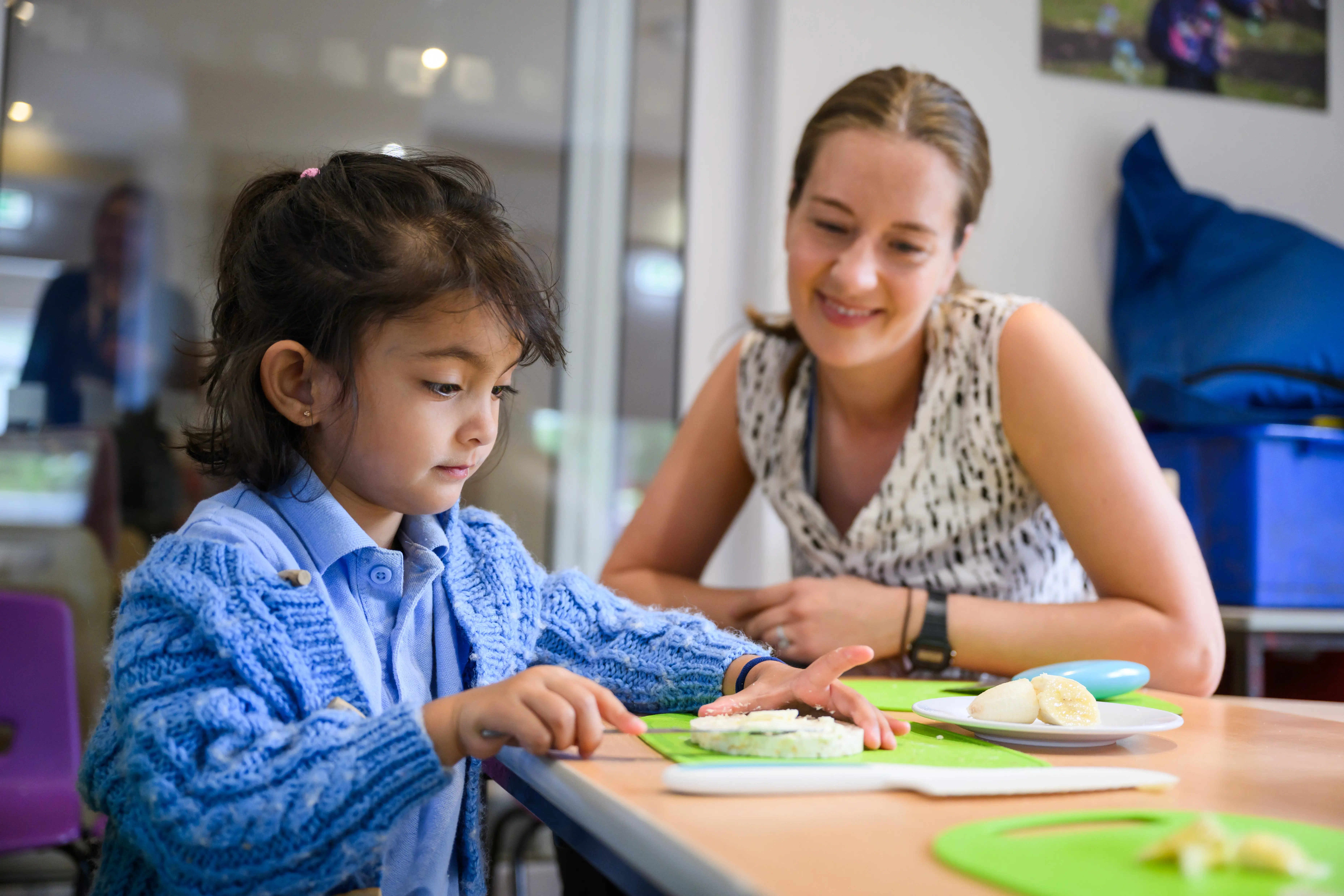 Teacher and student in cooking lesson