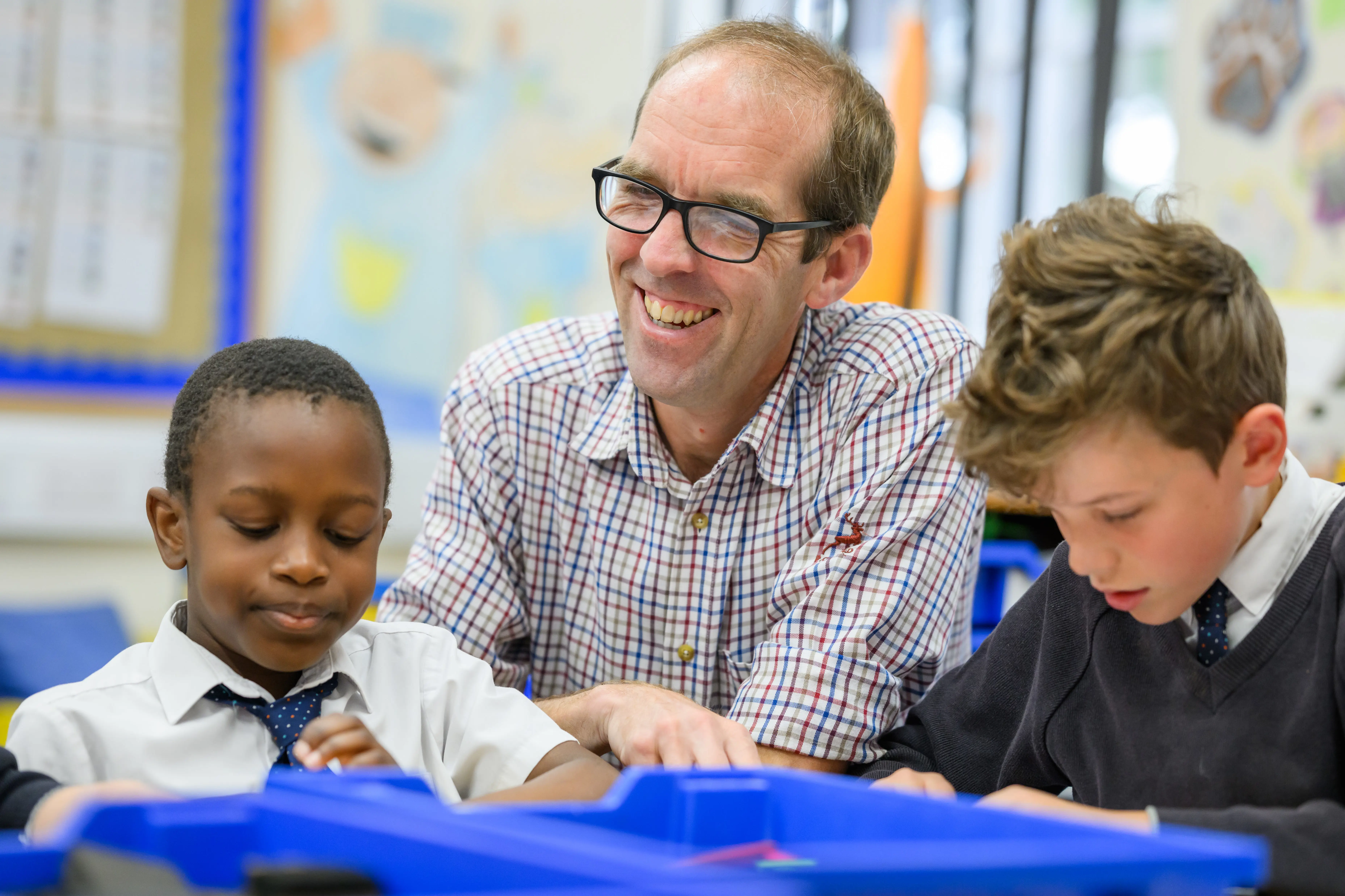Two students and a teacher sitting together