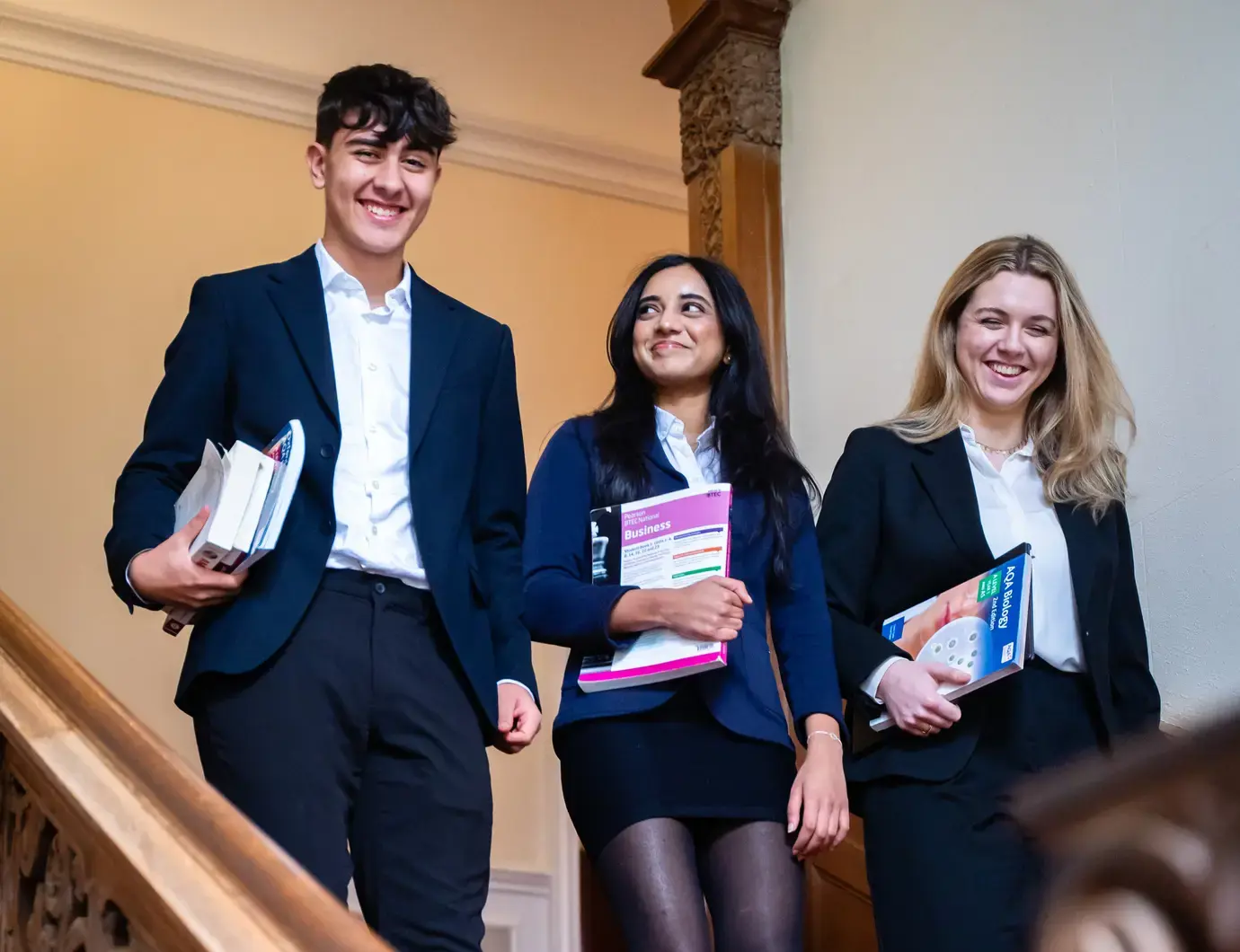 Sixth formers walking down stairs