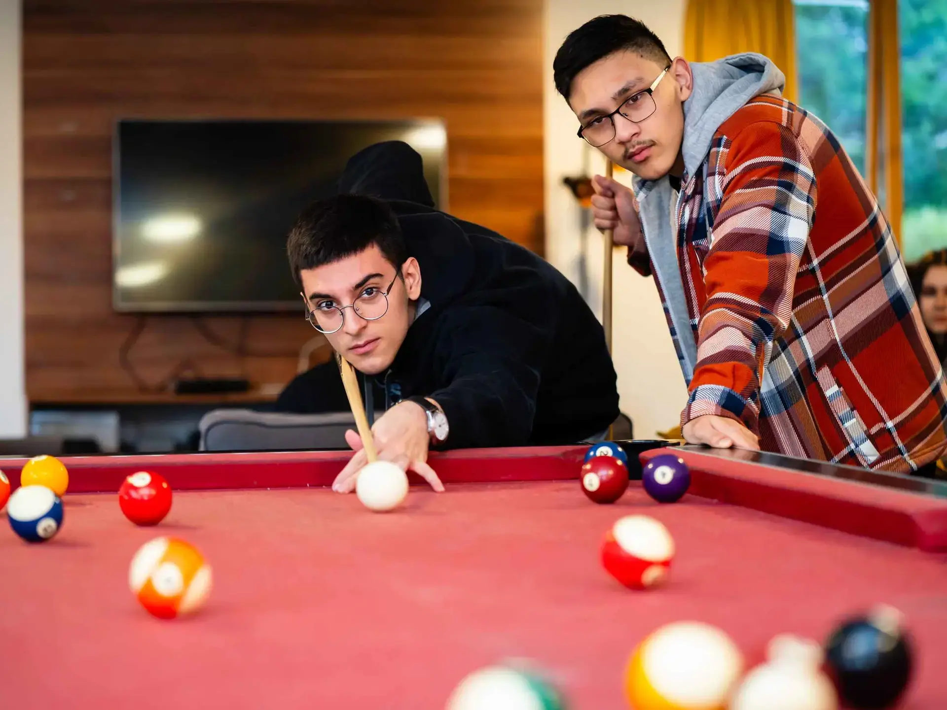 Students playing pool