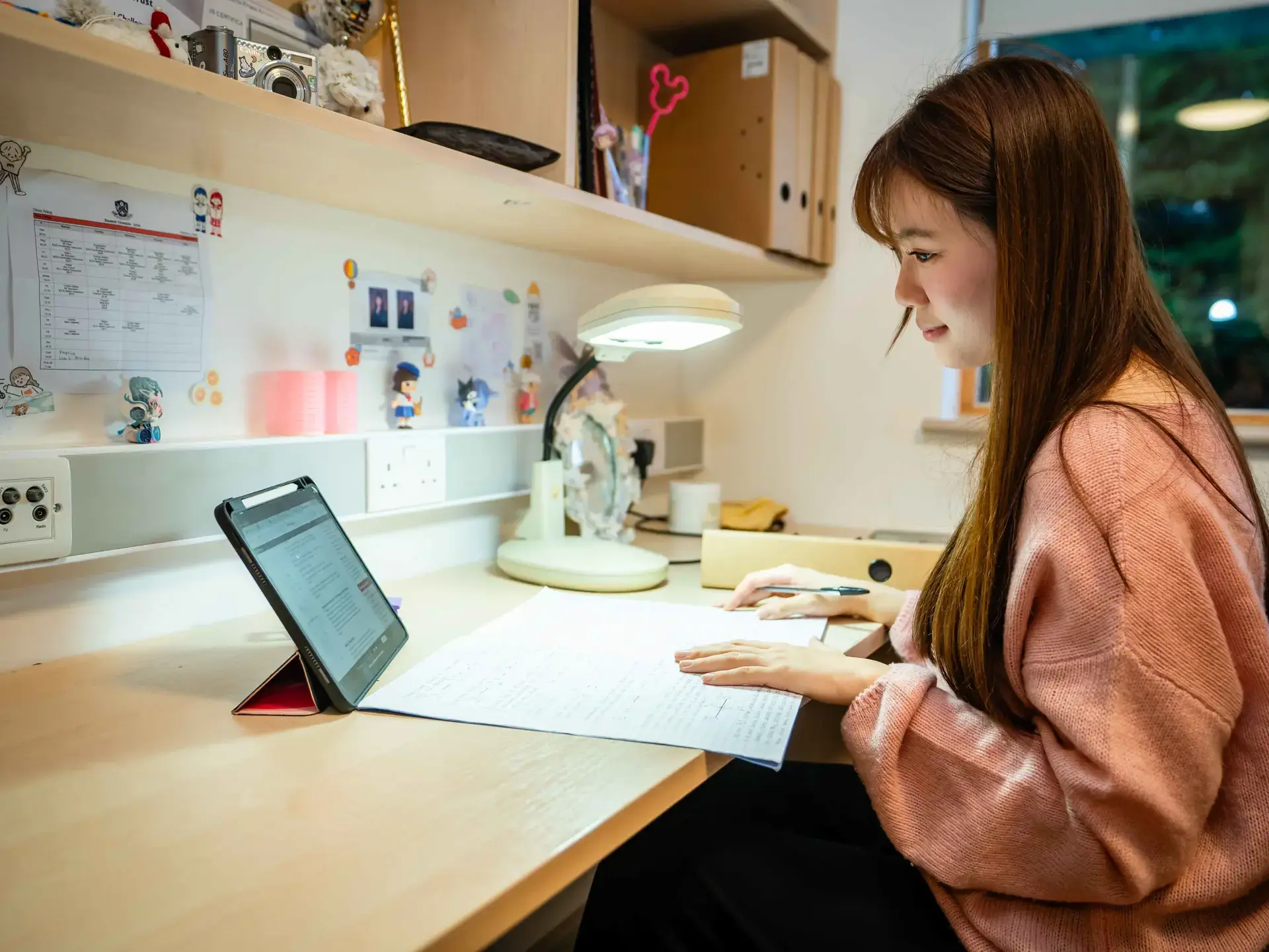 Student studying in bedroom