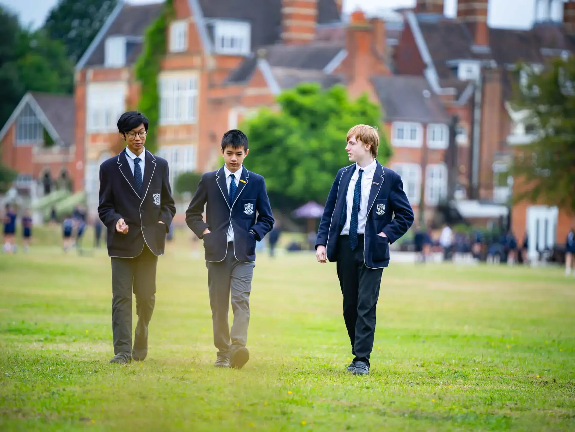 Students walking across field