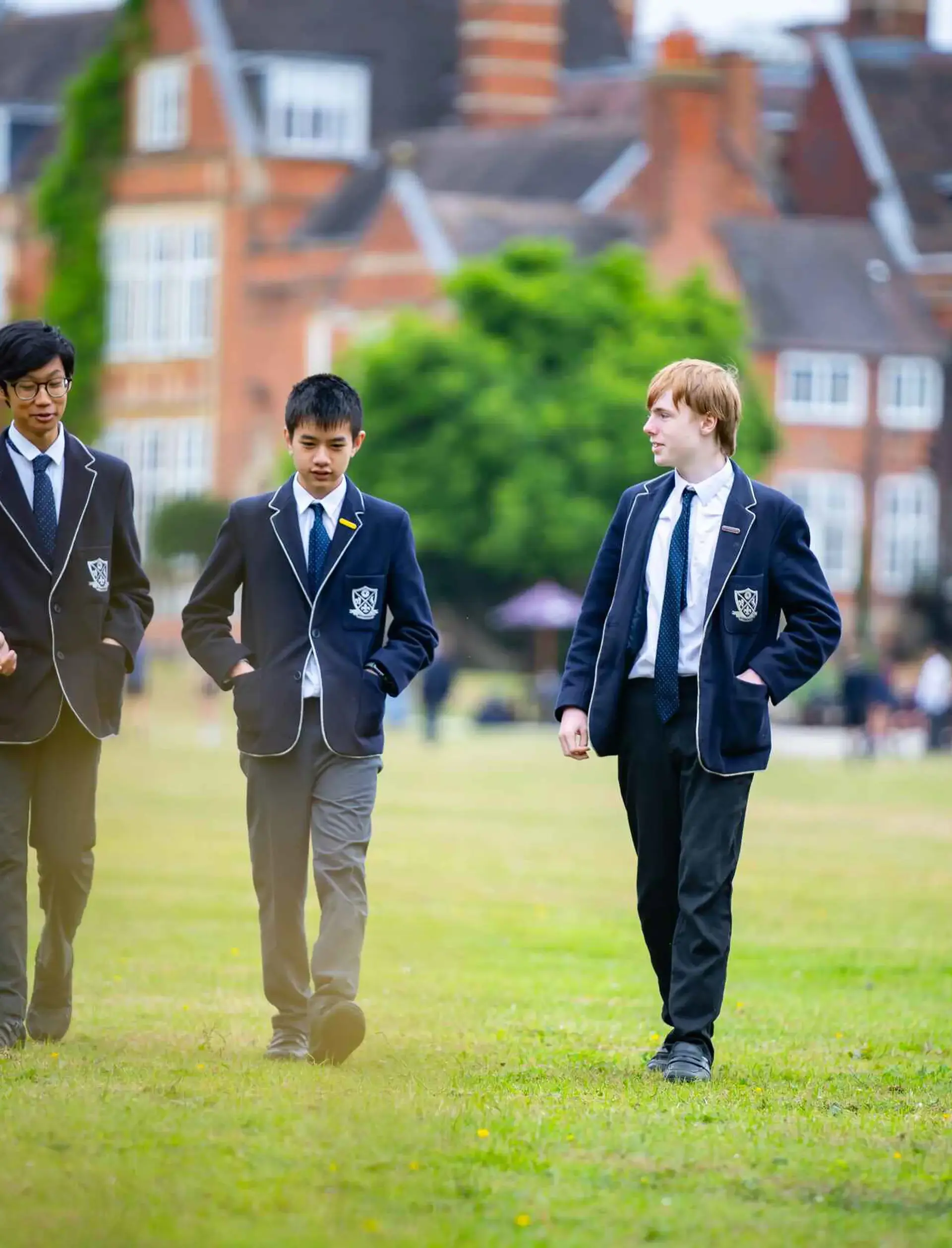 Students walking across field