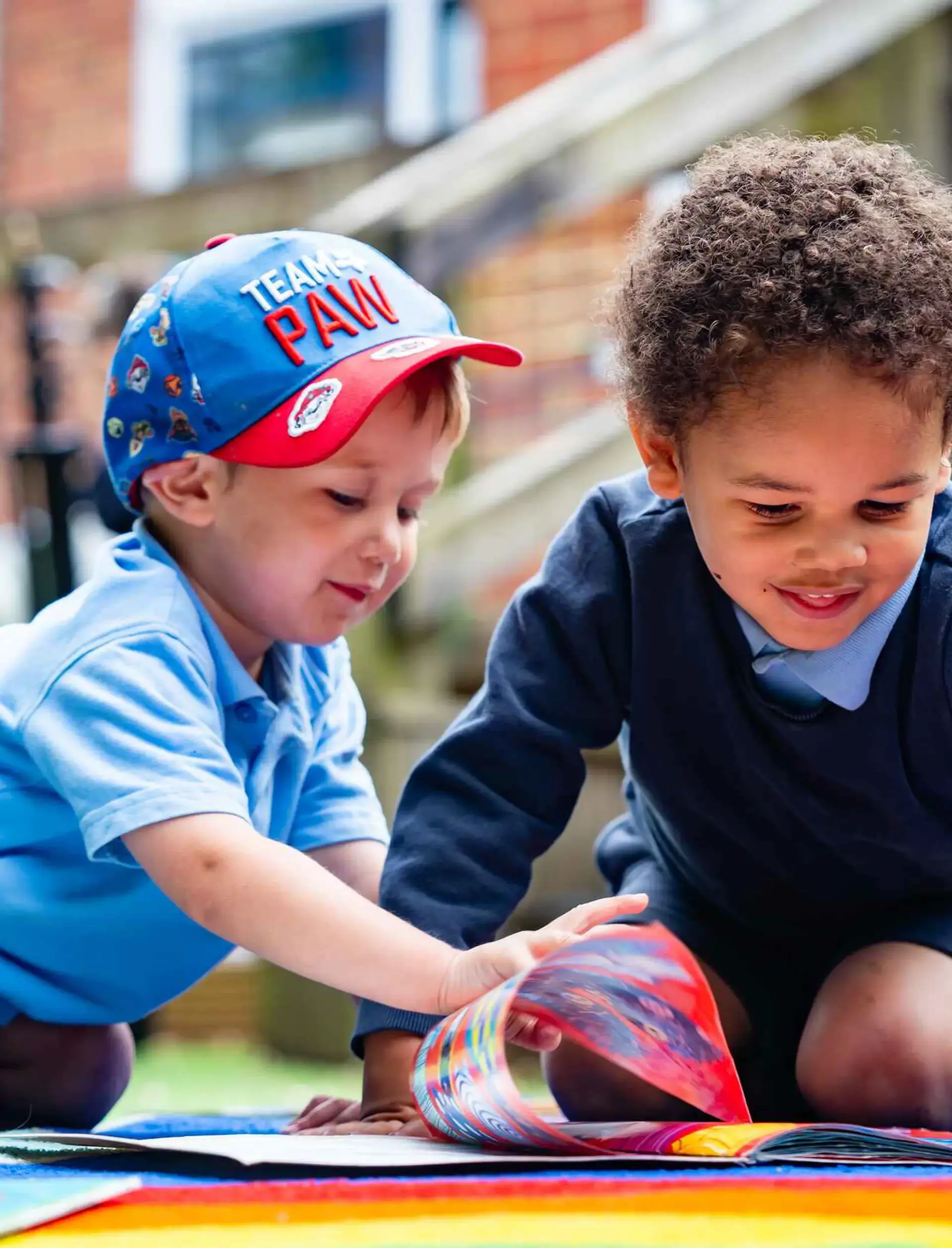 Two early years students playing together