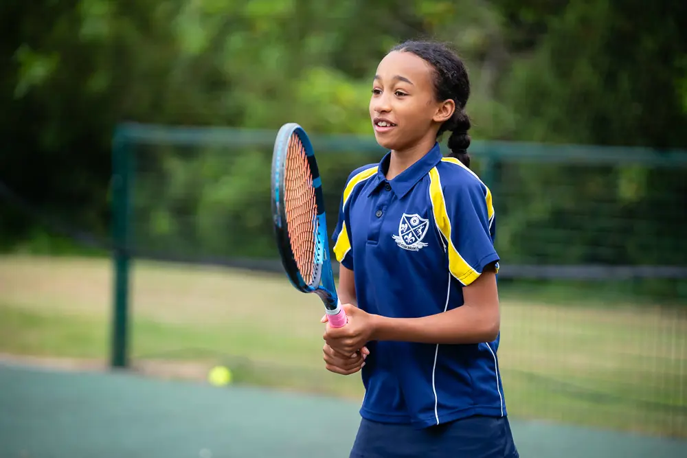 Student Playing Tennis