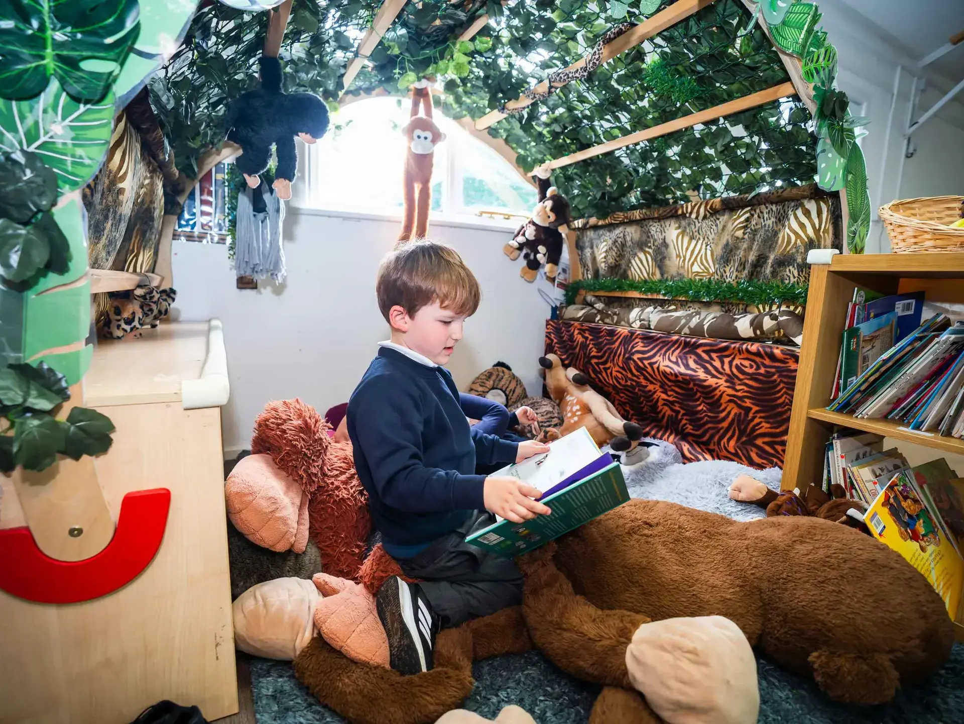 Student reading in comfy area