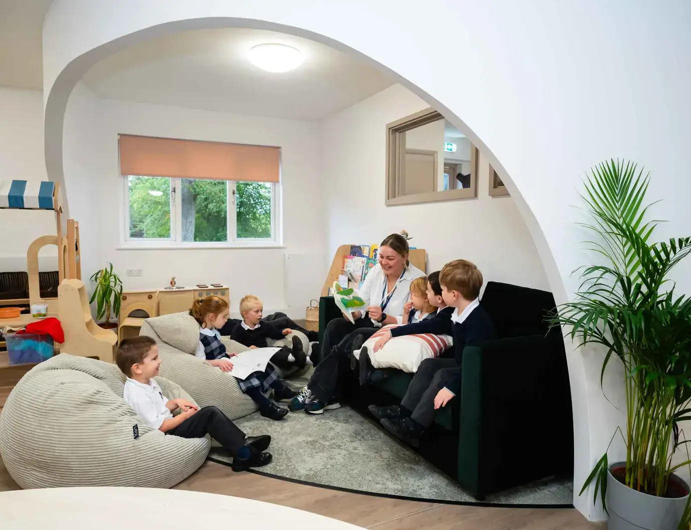 Students and teachers in reading nook