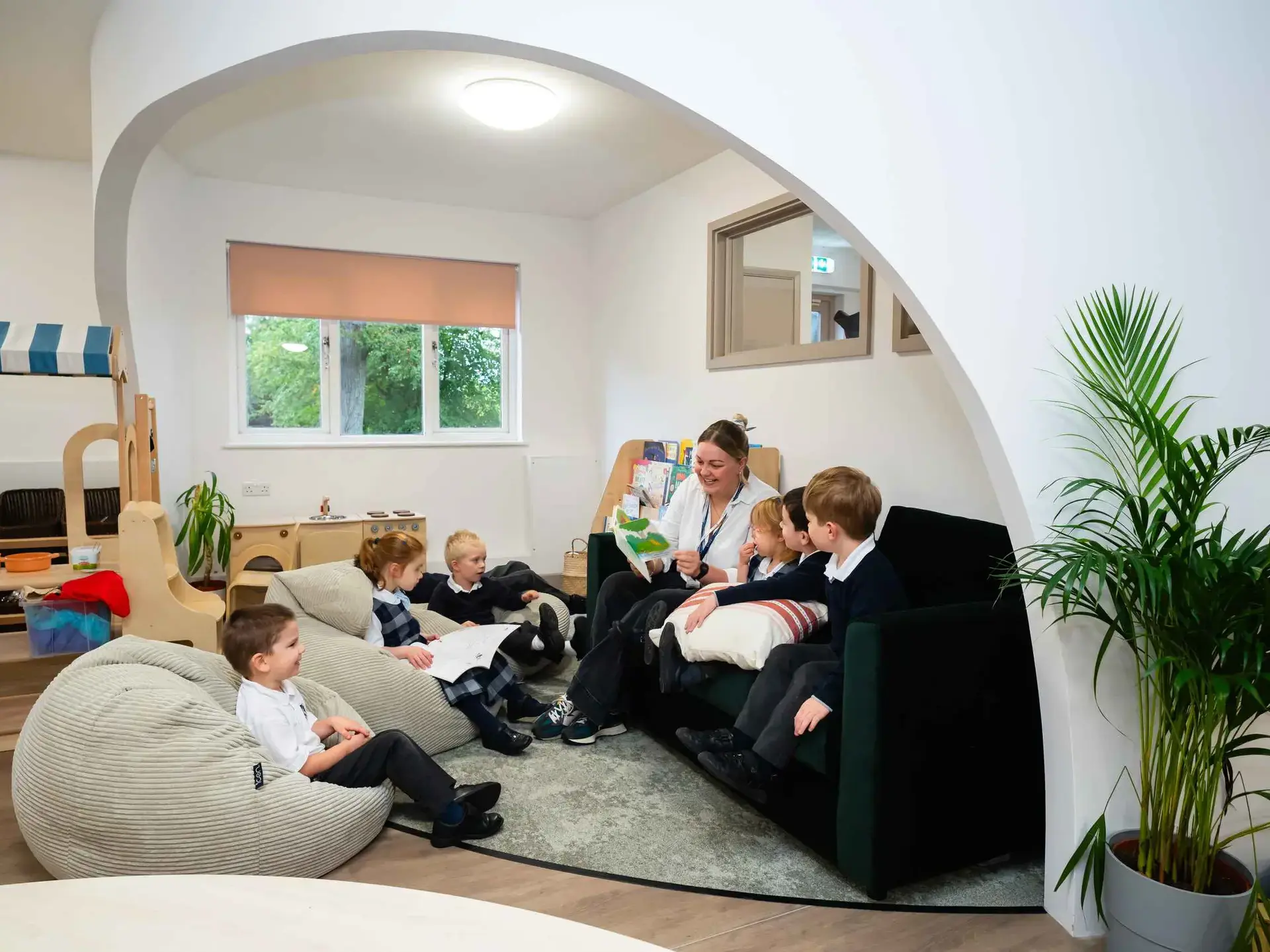 Students and teachers in reading nook