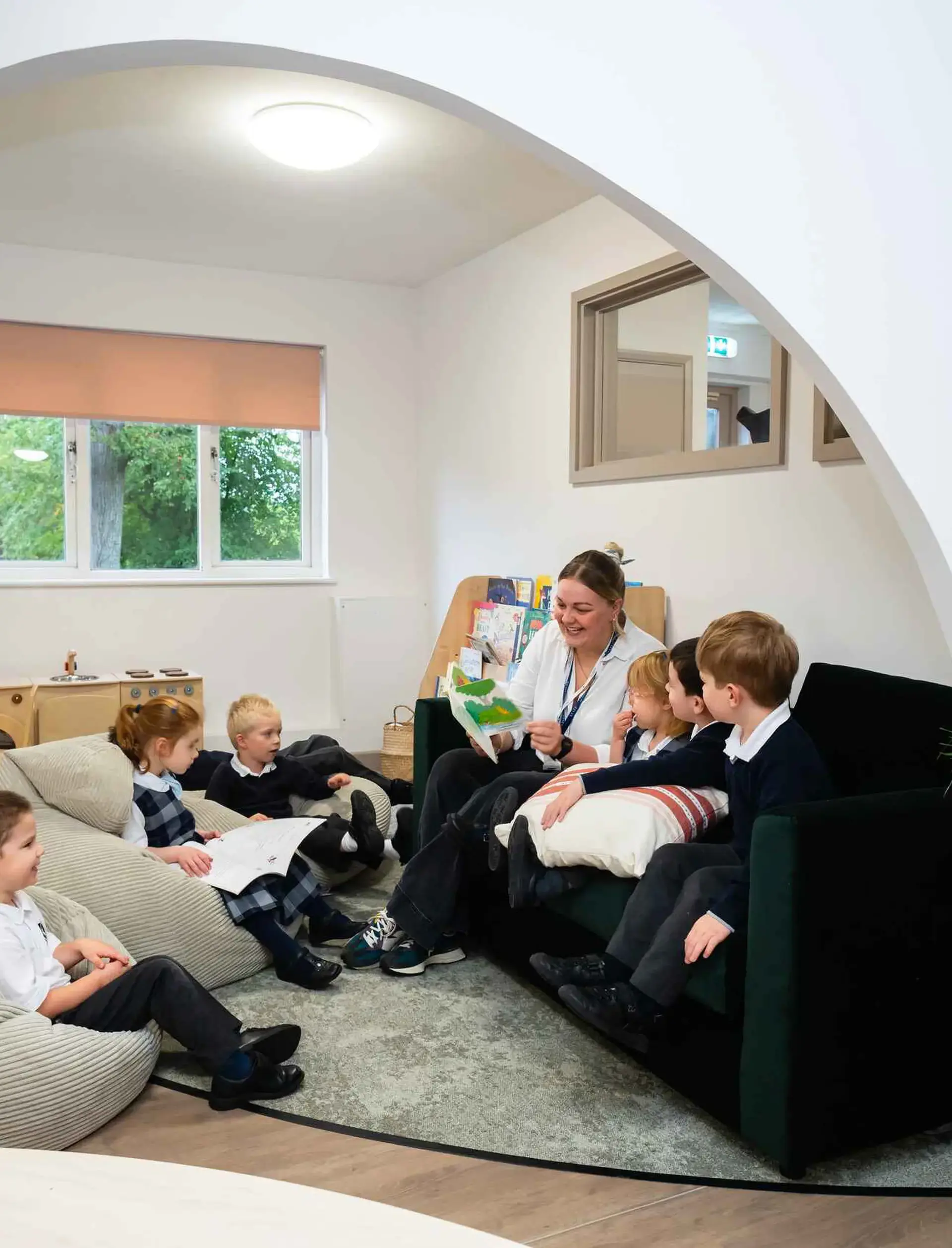 Students and teacher sitting together in alcove