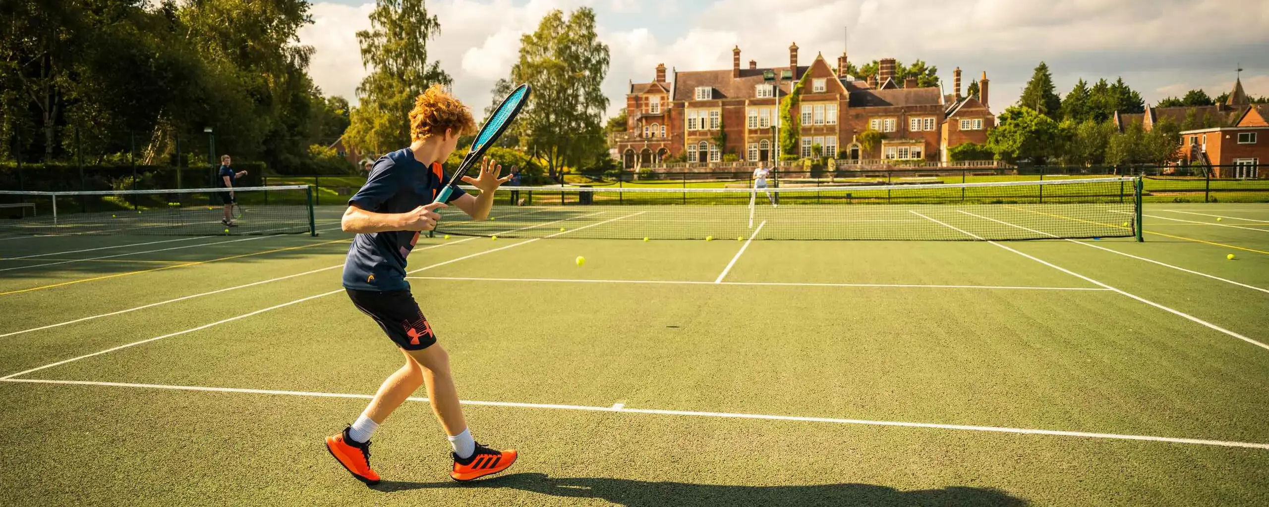 Senior Pupil Playing Tennis at Sherfield