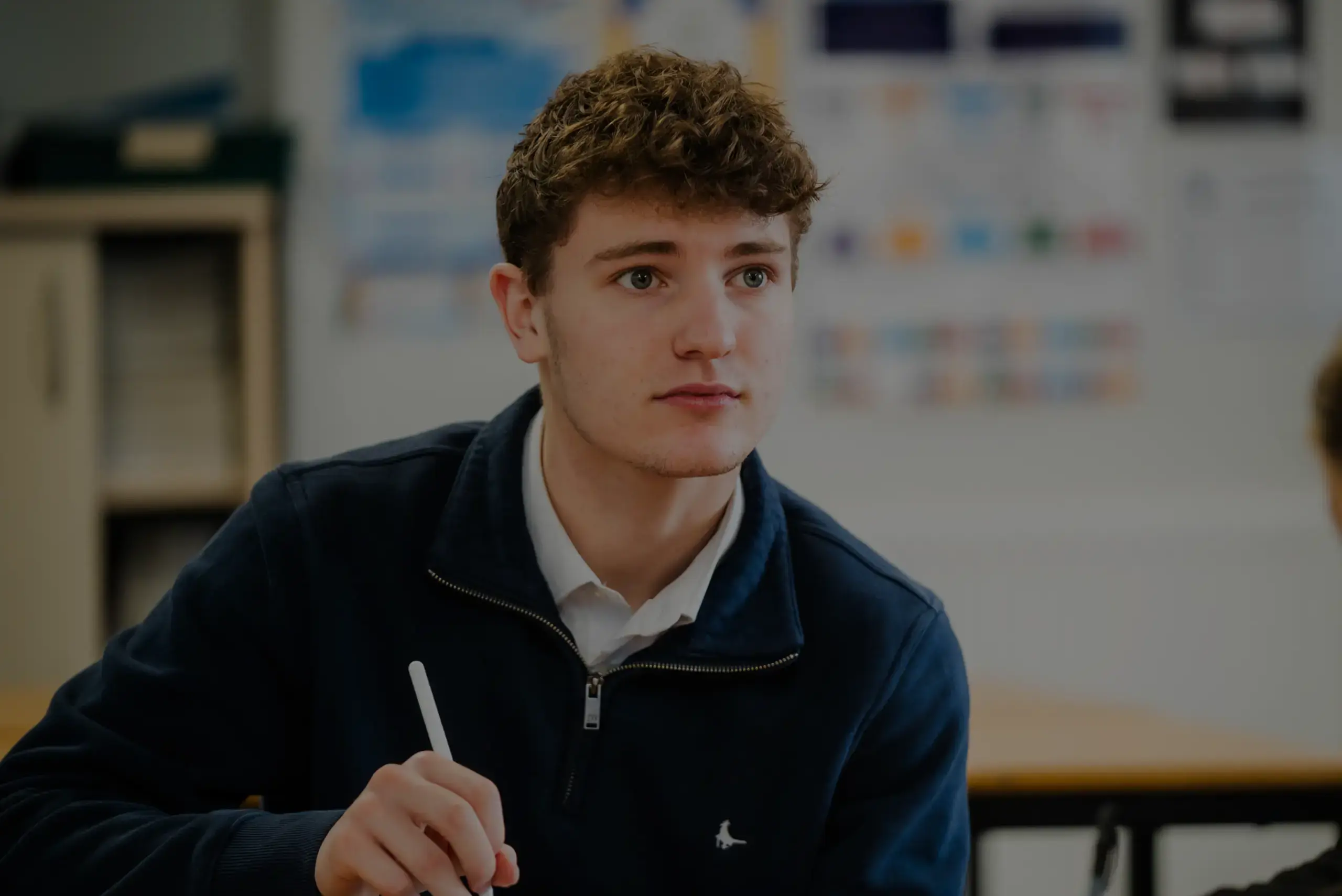 Student taking notes in lesson