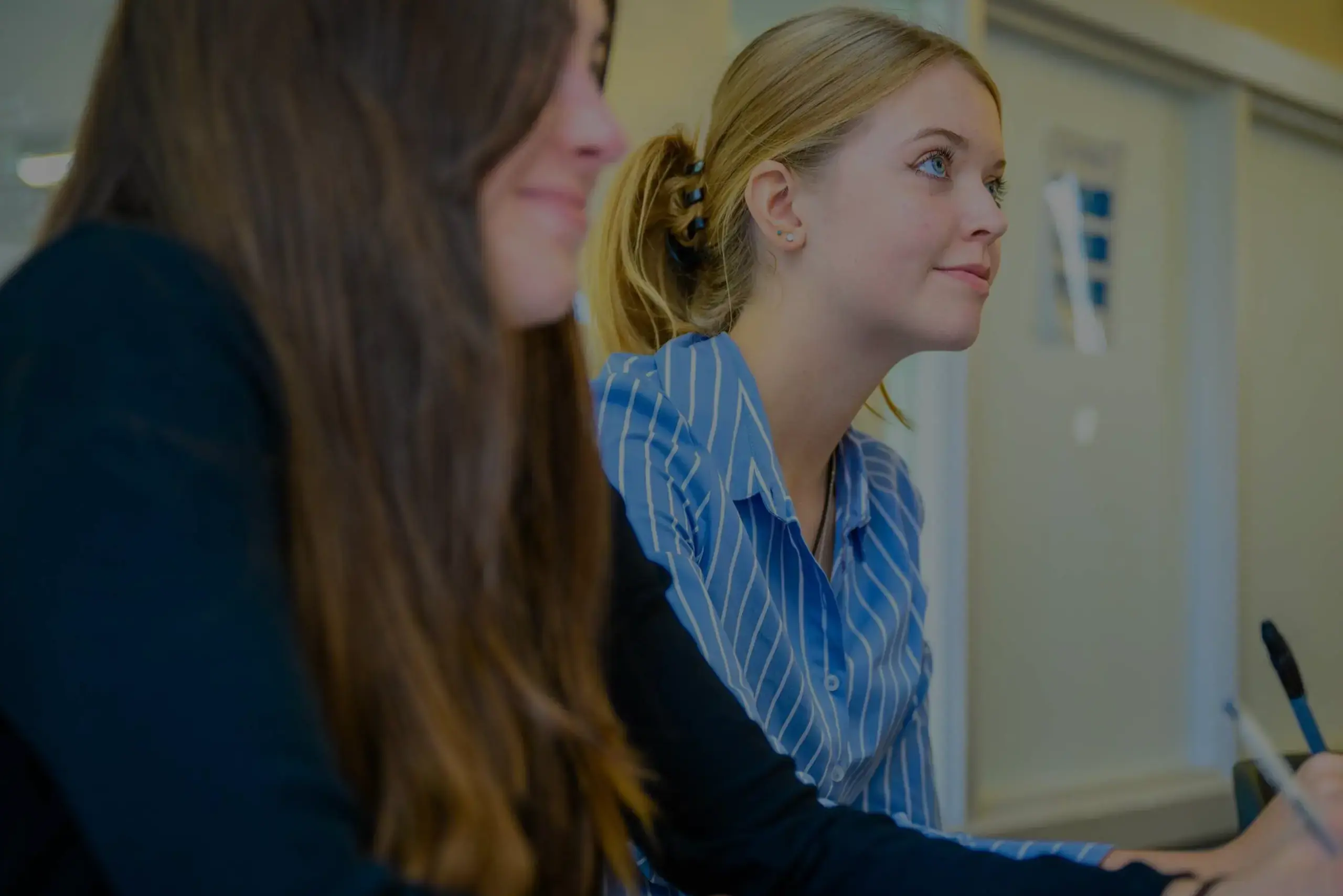 Students listening in lesson