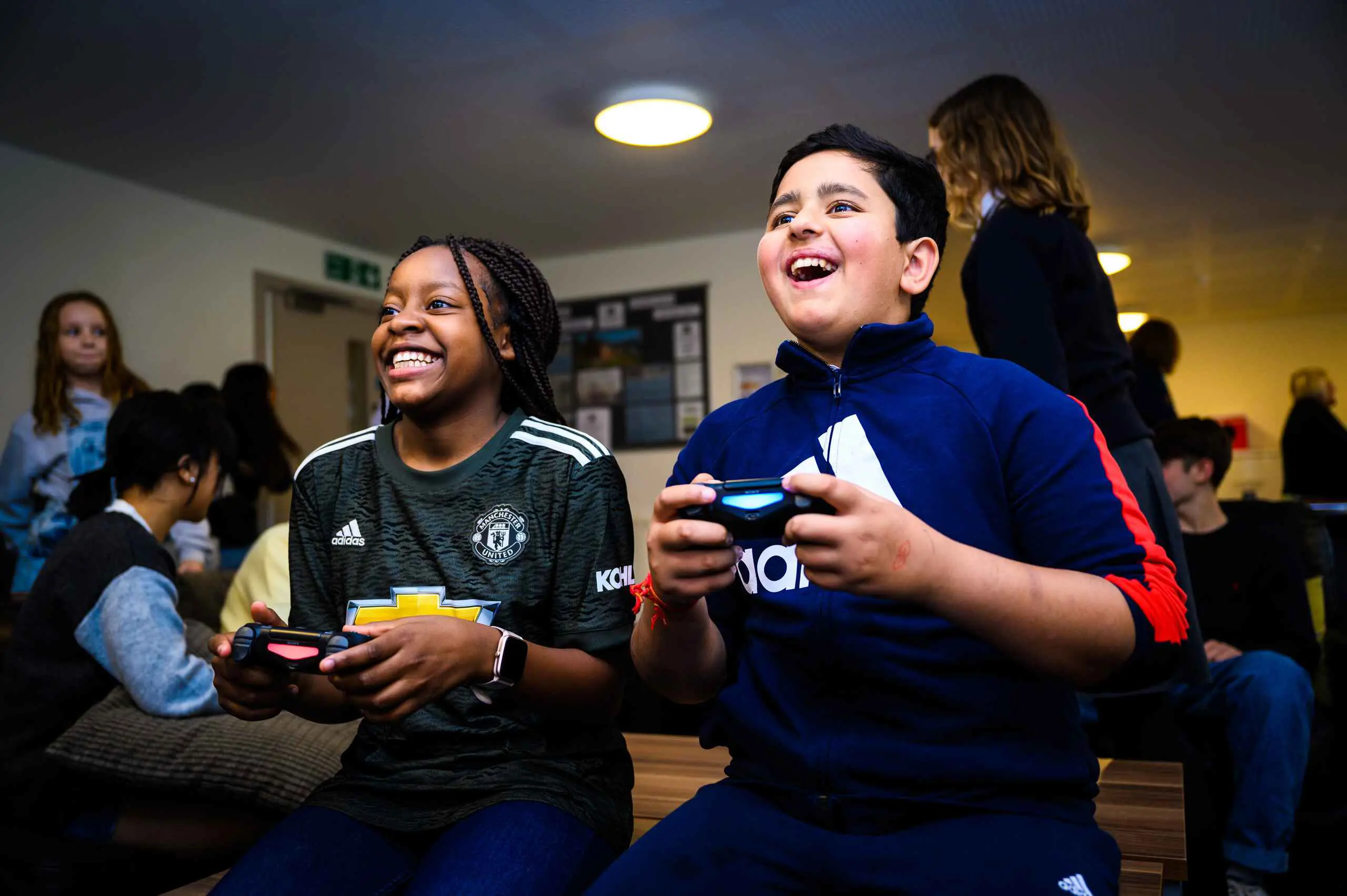 Boarding students playing video games together