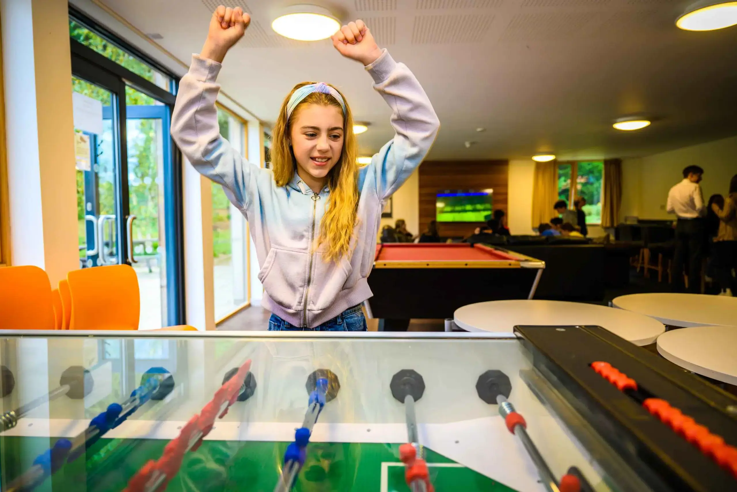 Student celebrating a foosball win