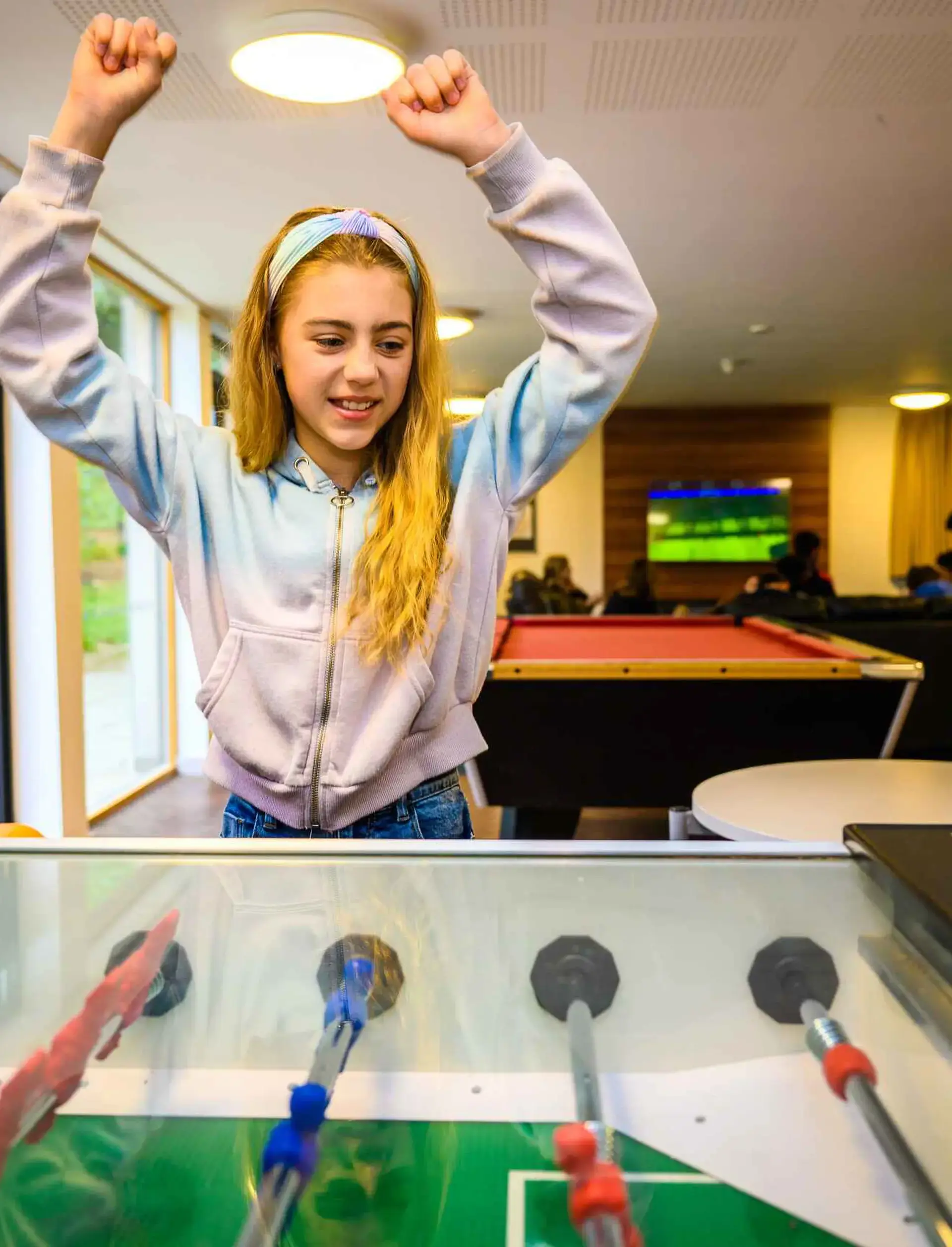 Student celebrating a foosball win