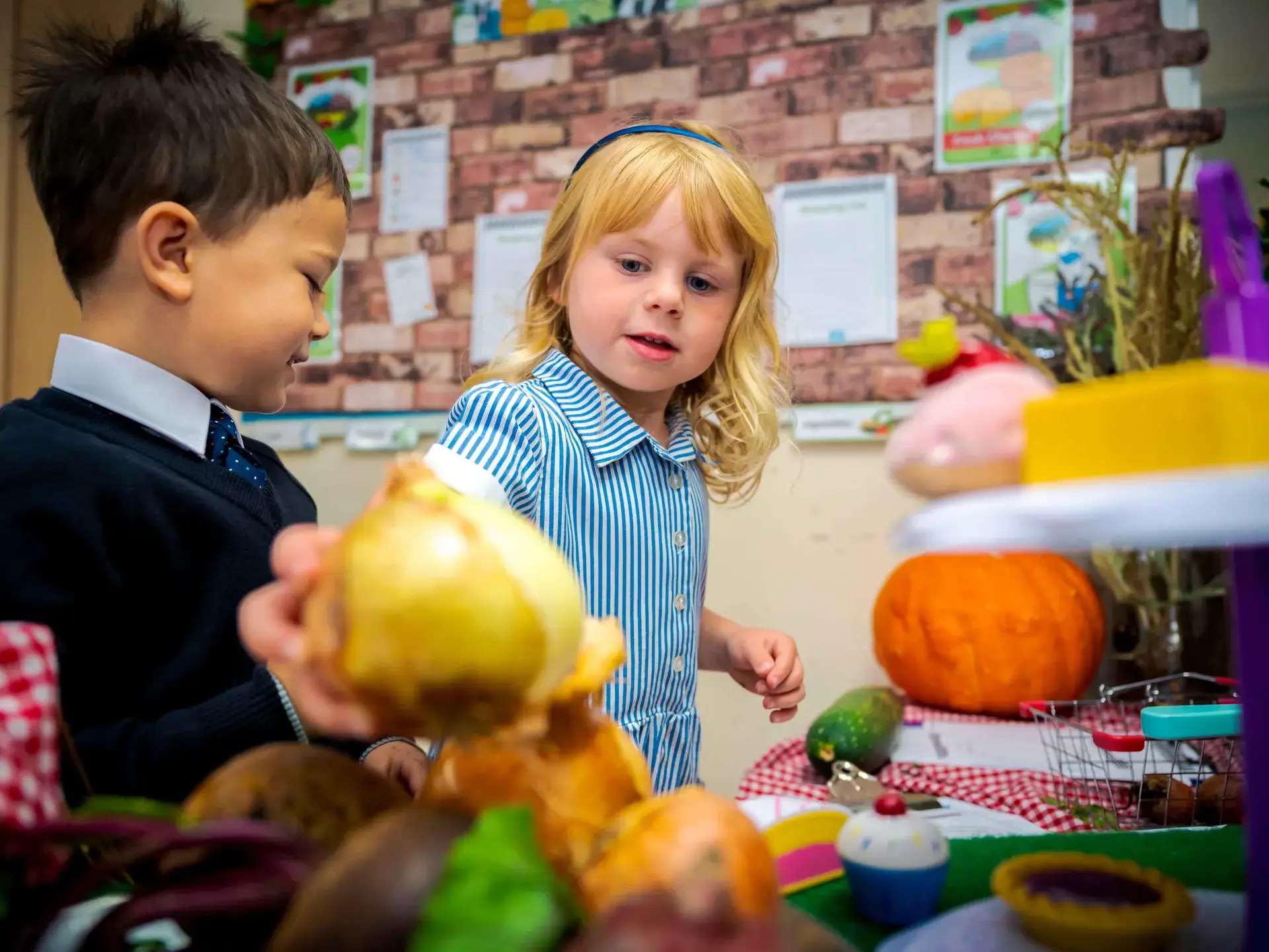Students handing fruit to each other