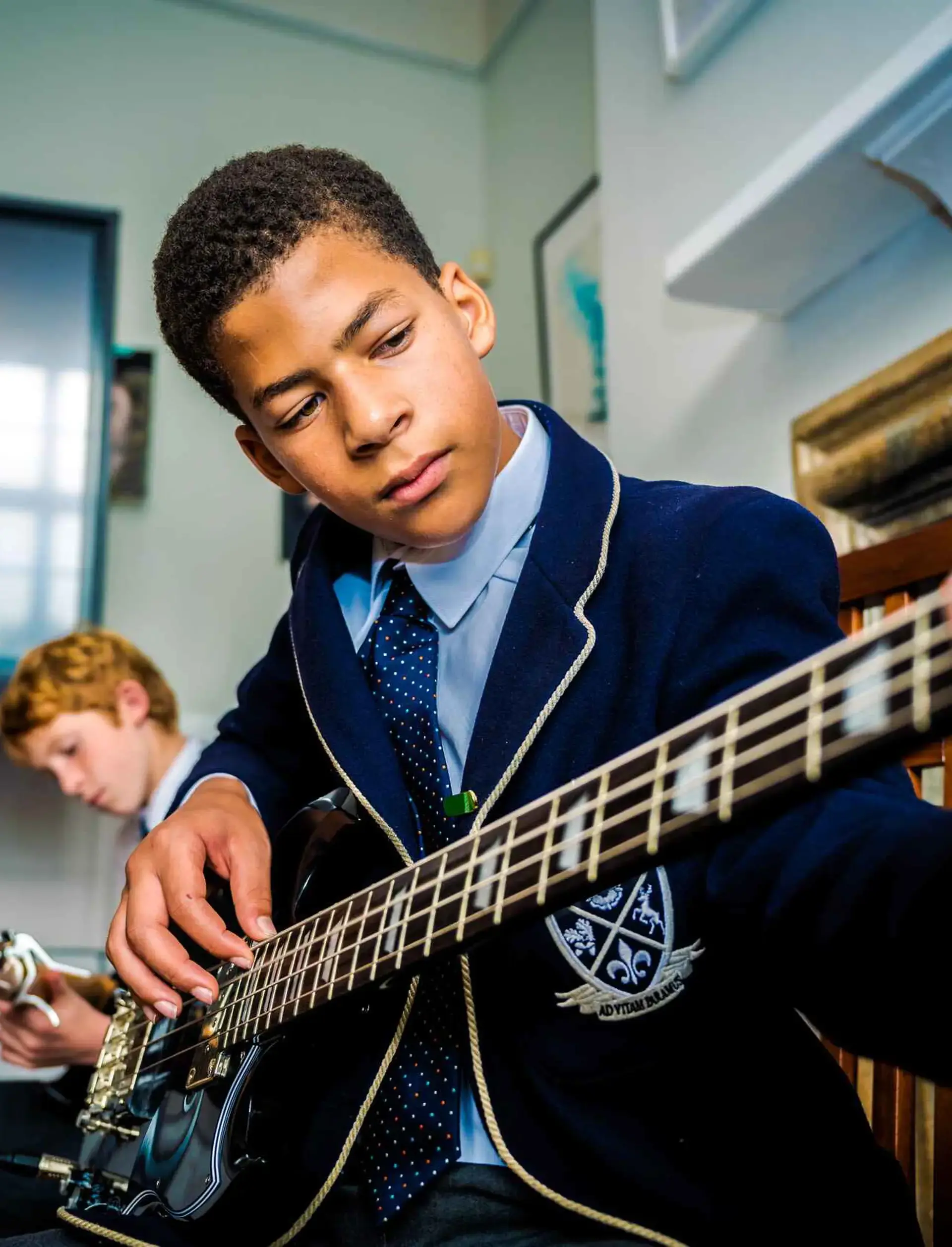 Student playing guitar