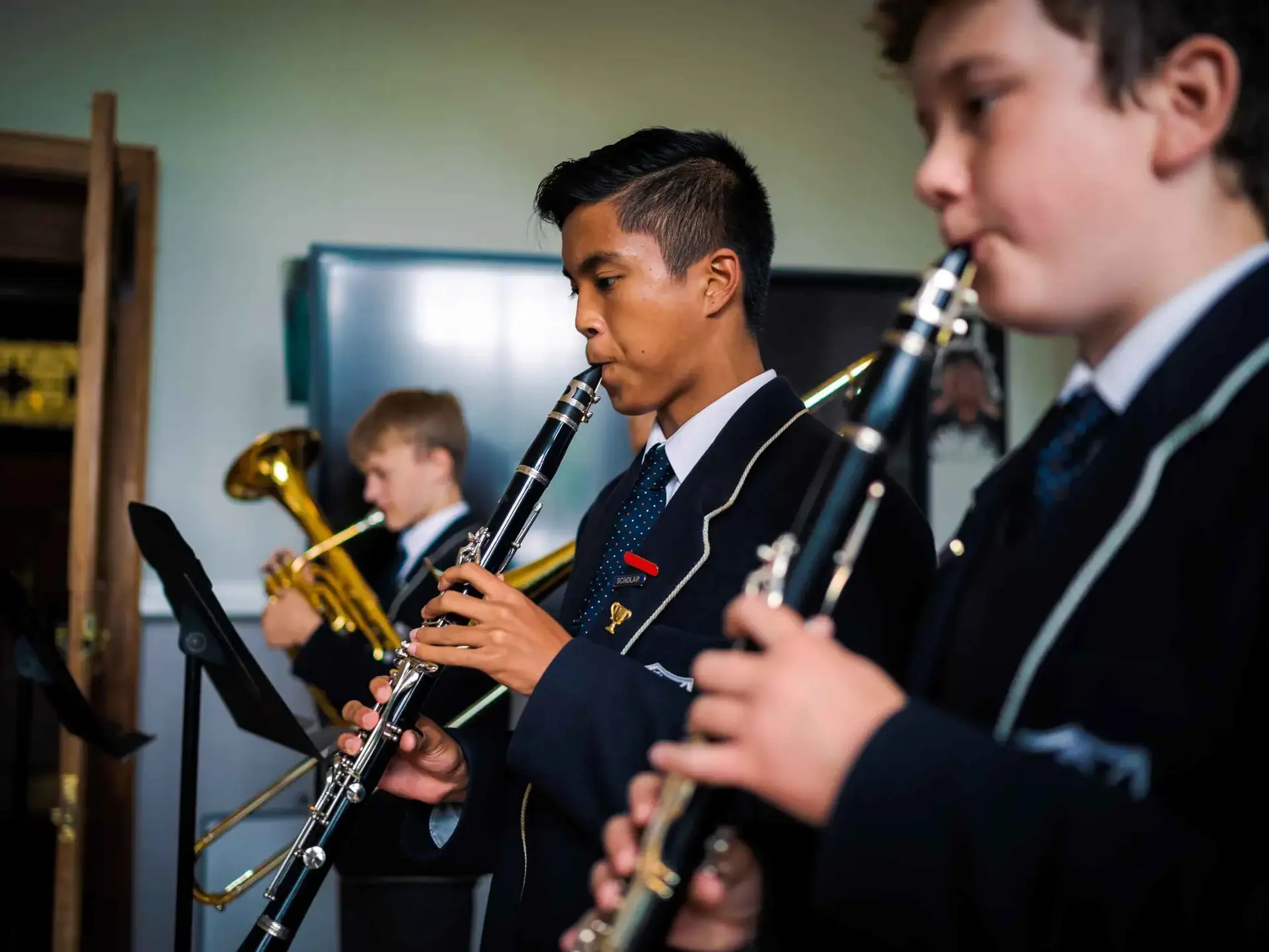 Students playing woodwind and brass instruments