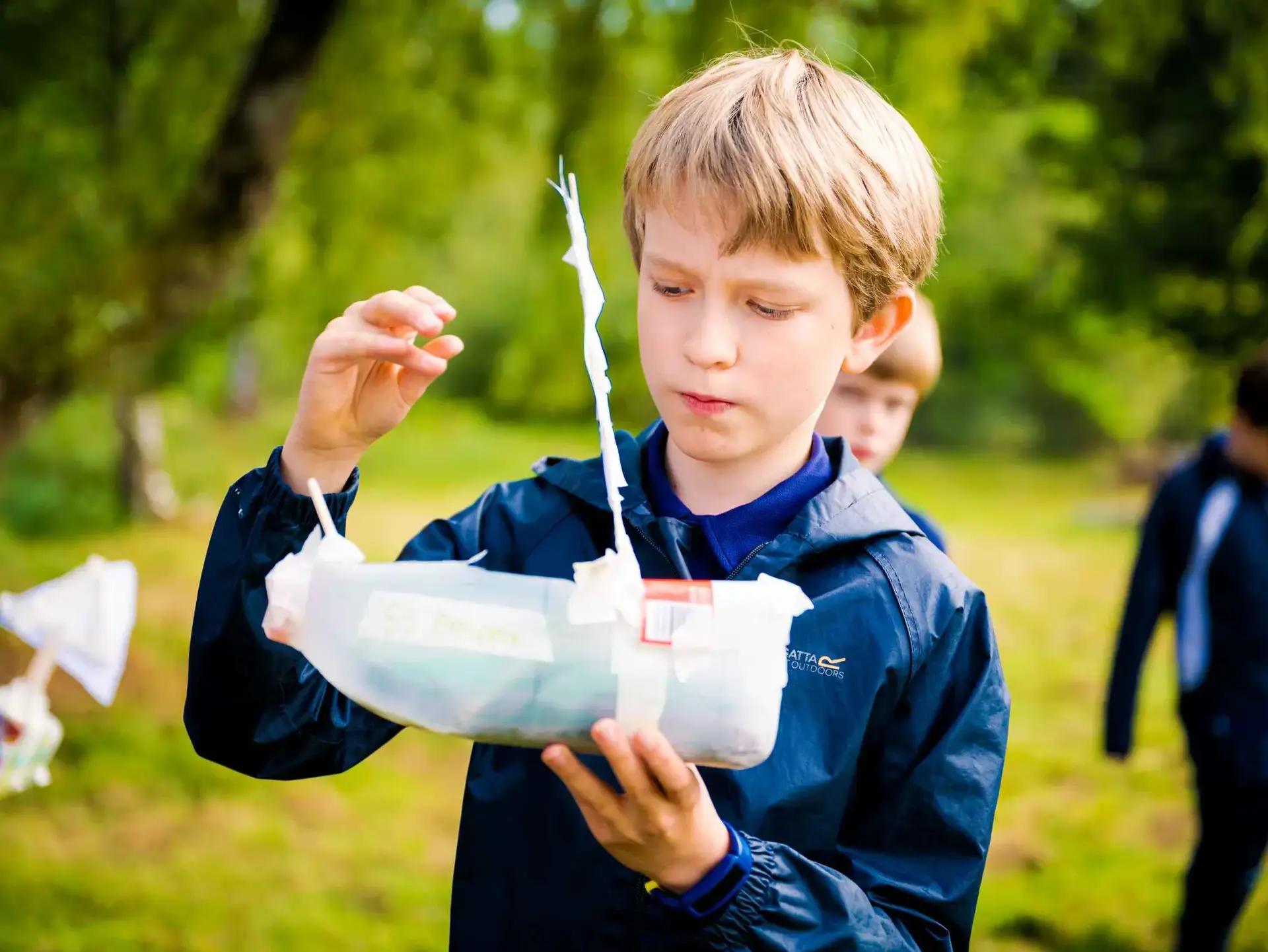 Student holding bottle experiment