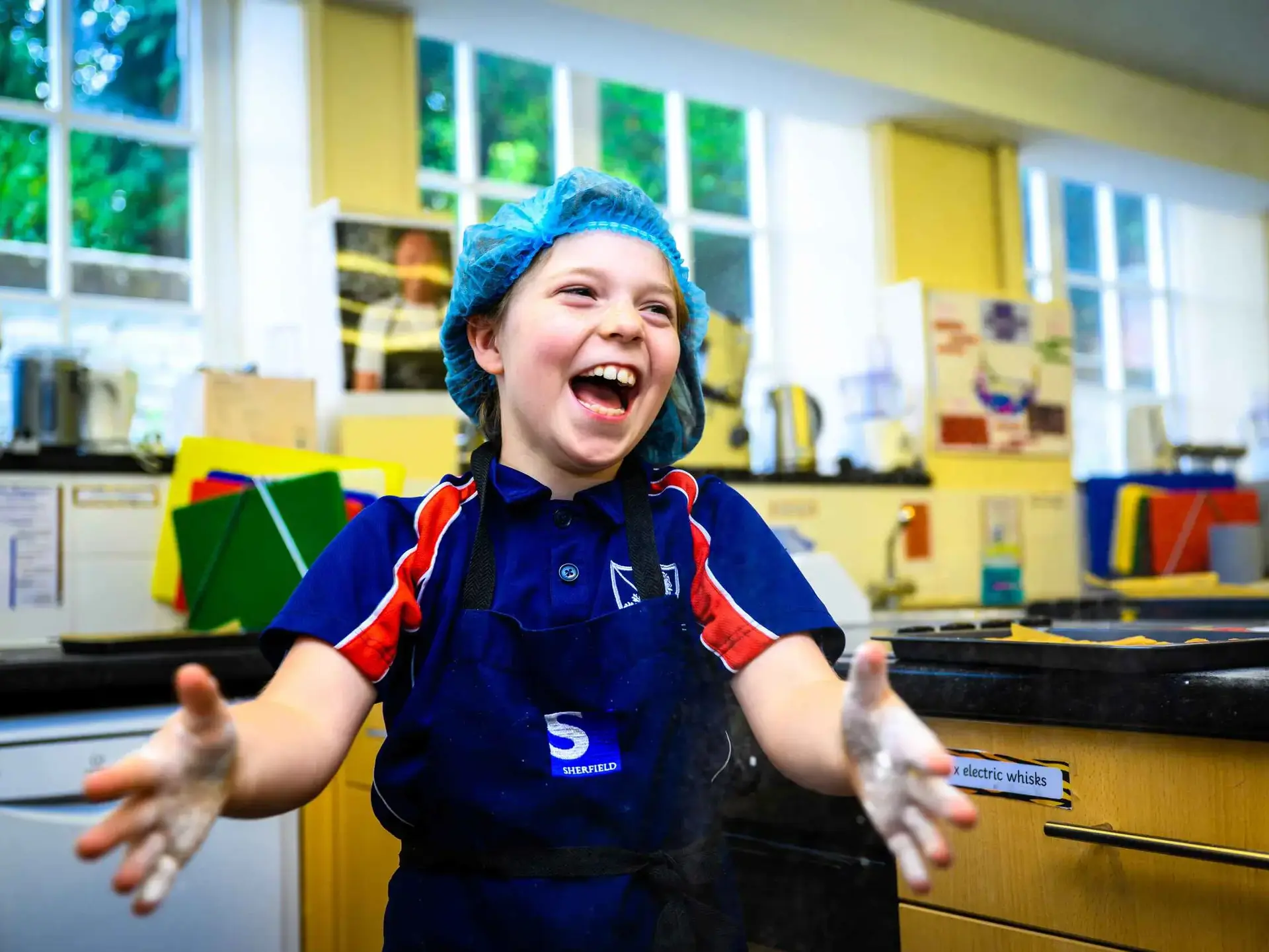 Smiling student with open arms 