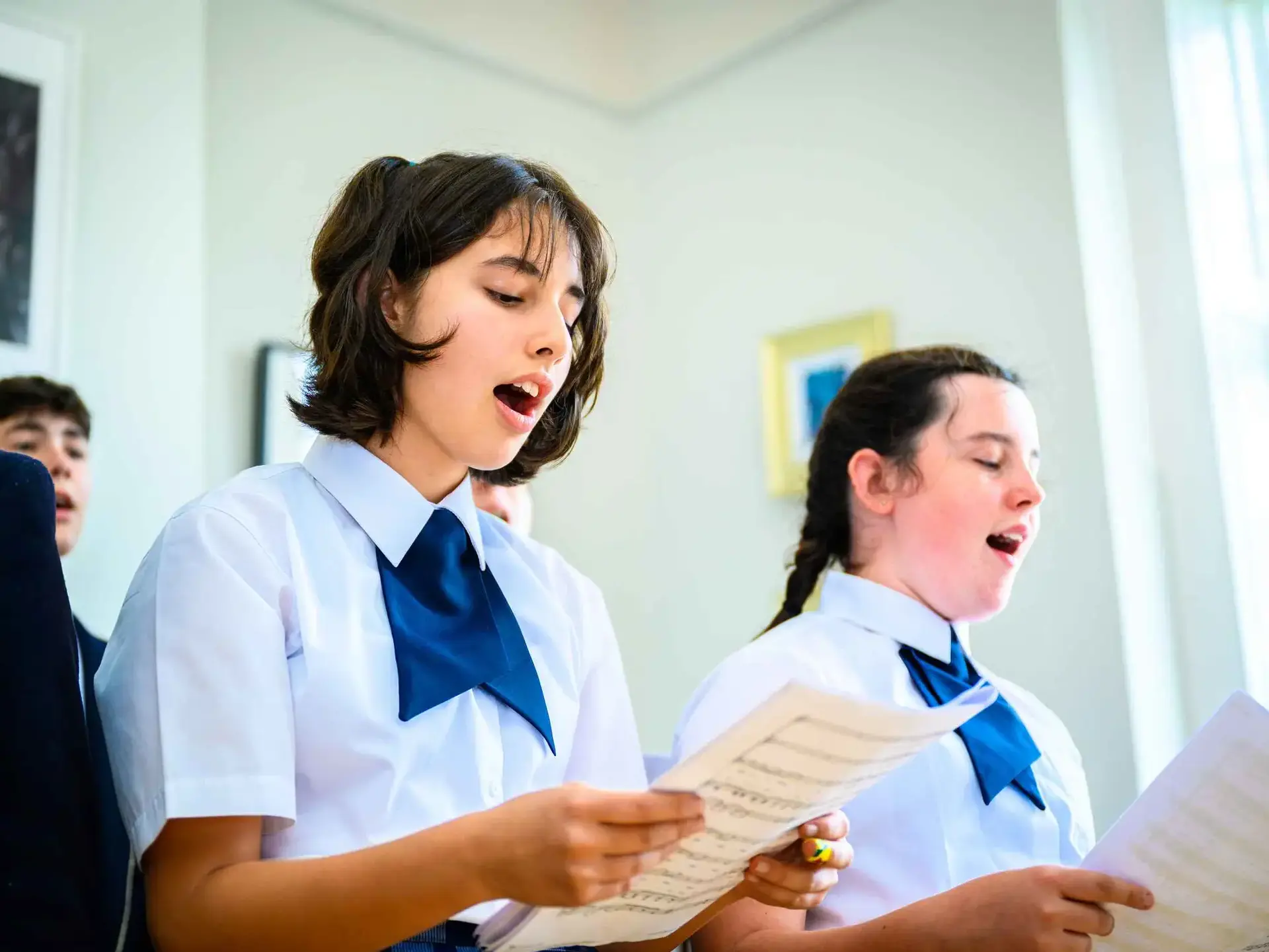 Students singing from sheet music