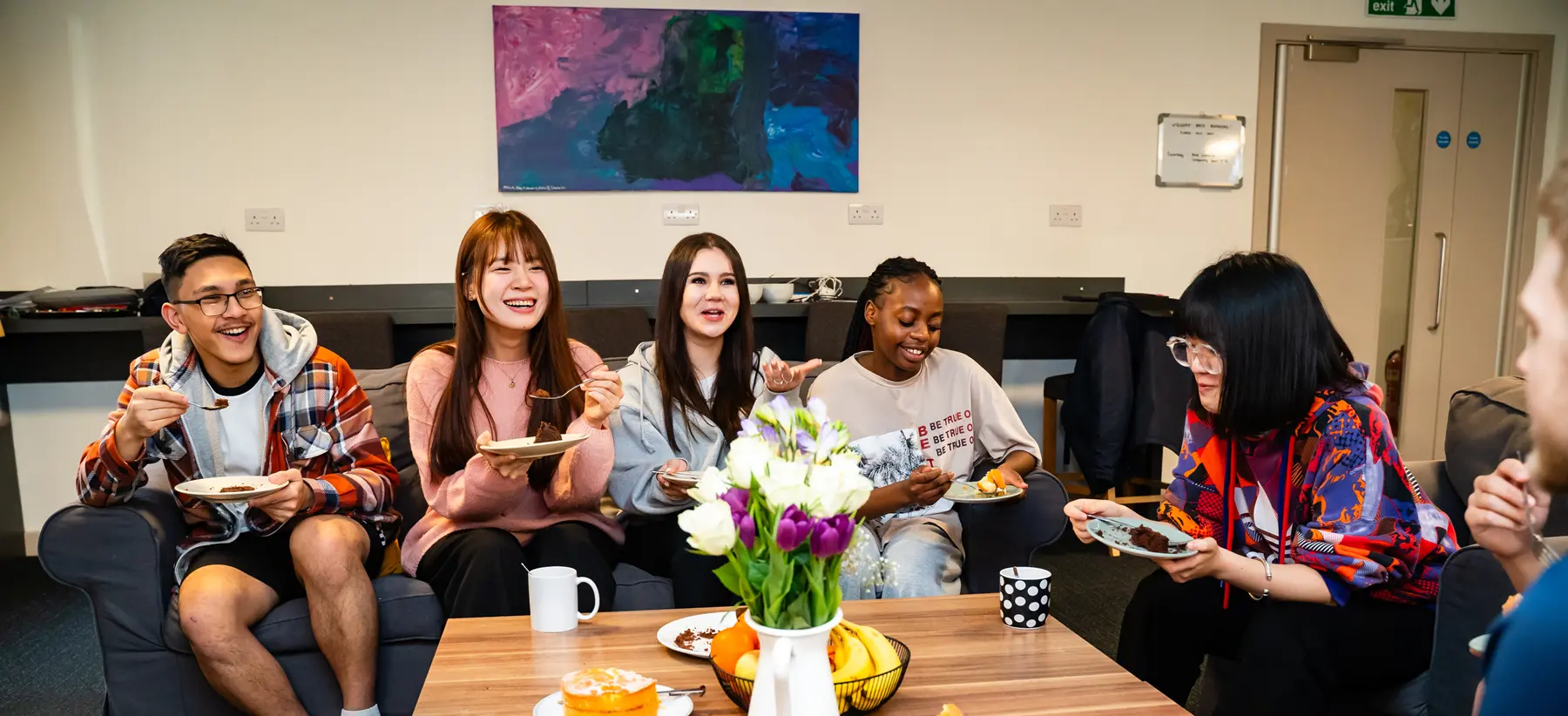 Students hanging out in boarding common area
