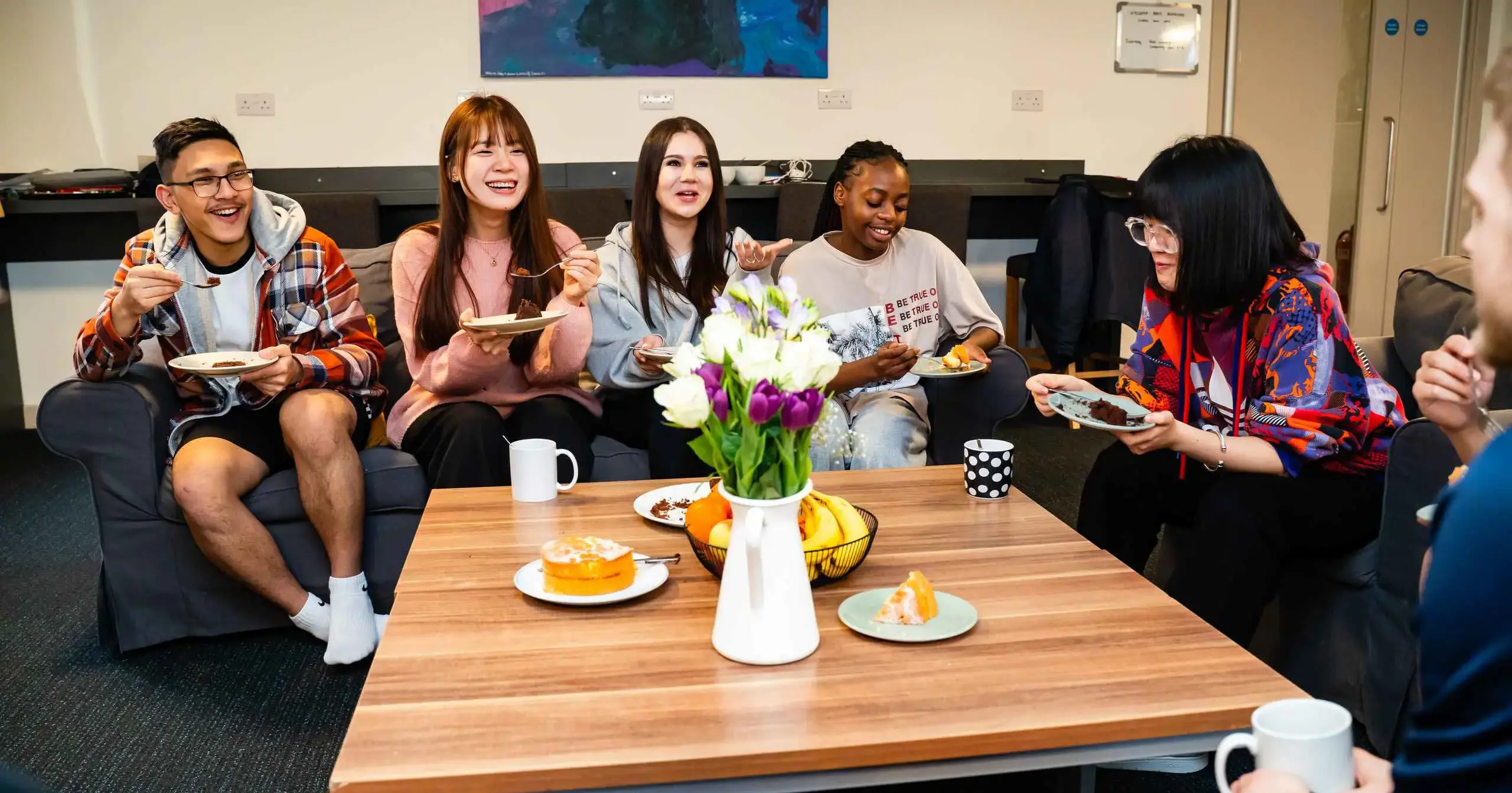 Students sitting in boarding lounge