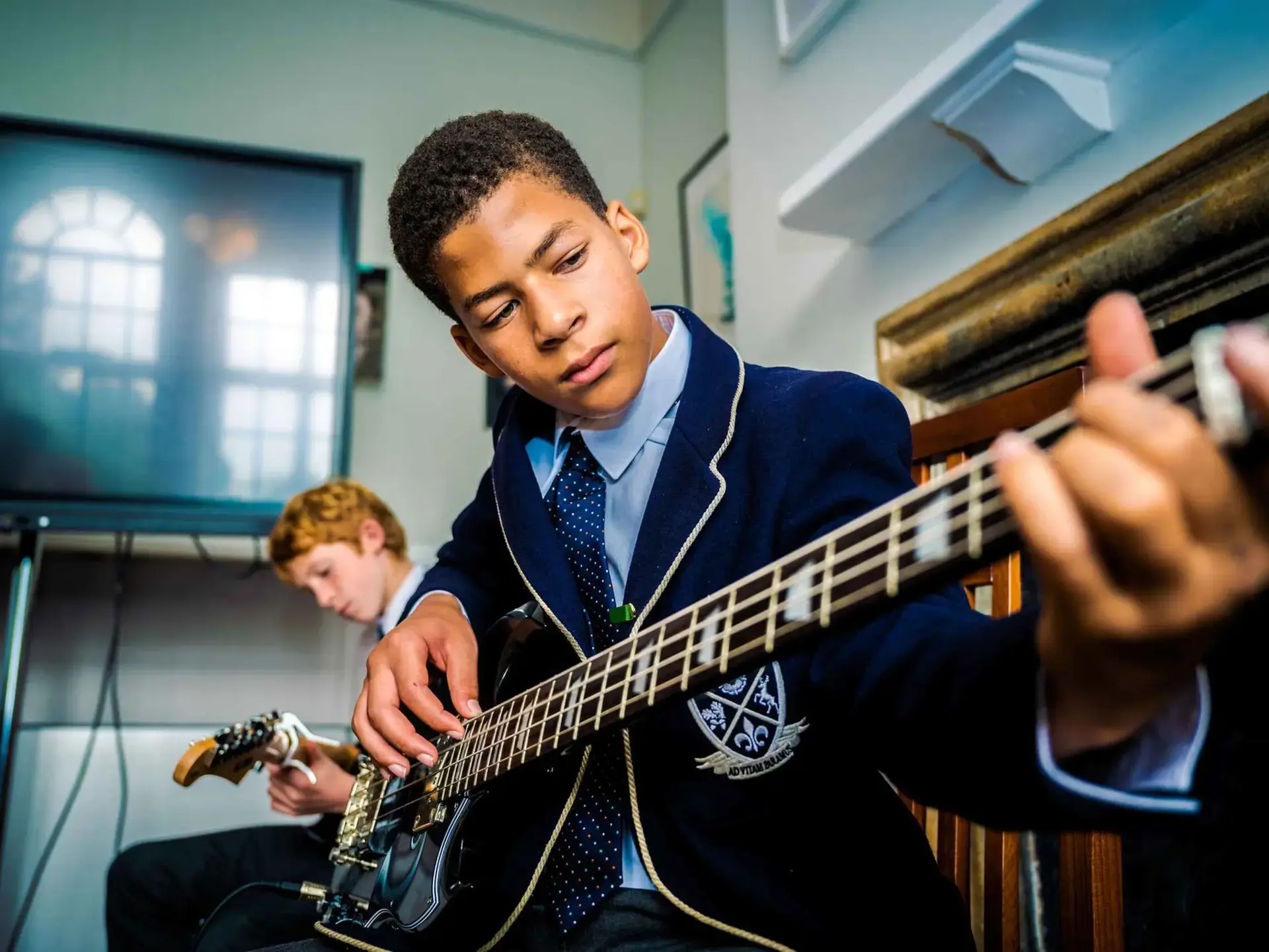 Student playing guitar