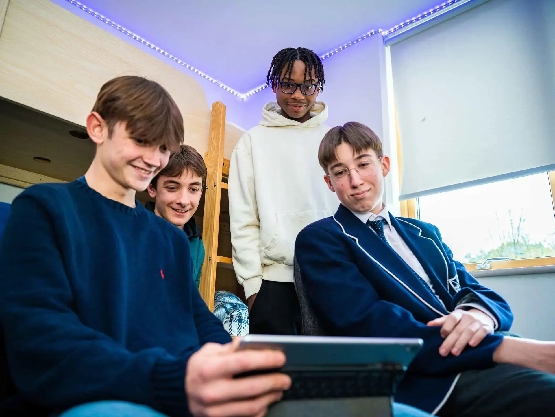 Students looking at tablet