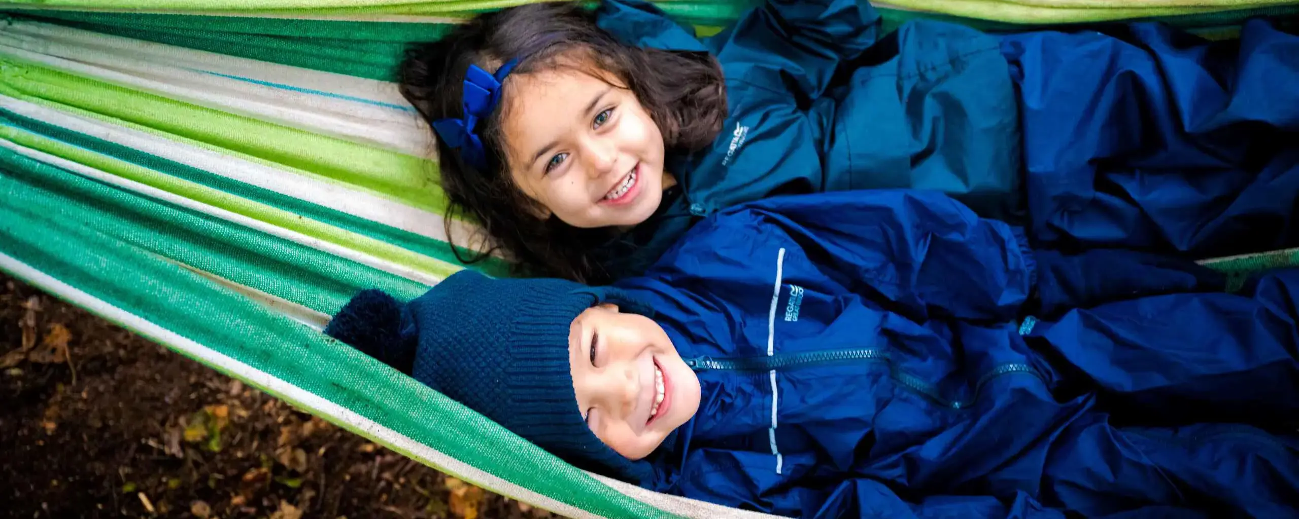 Smilings students in hammock
