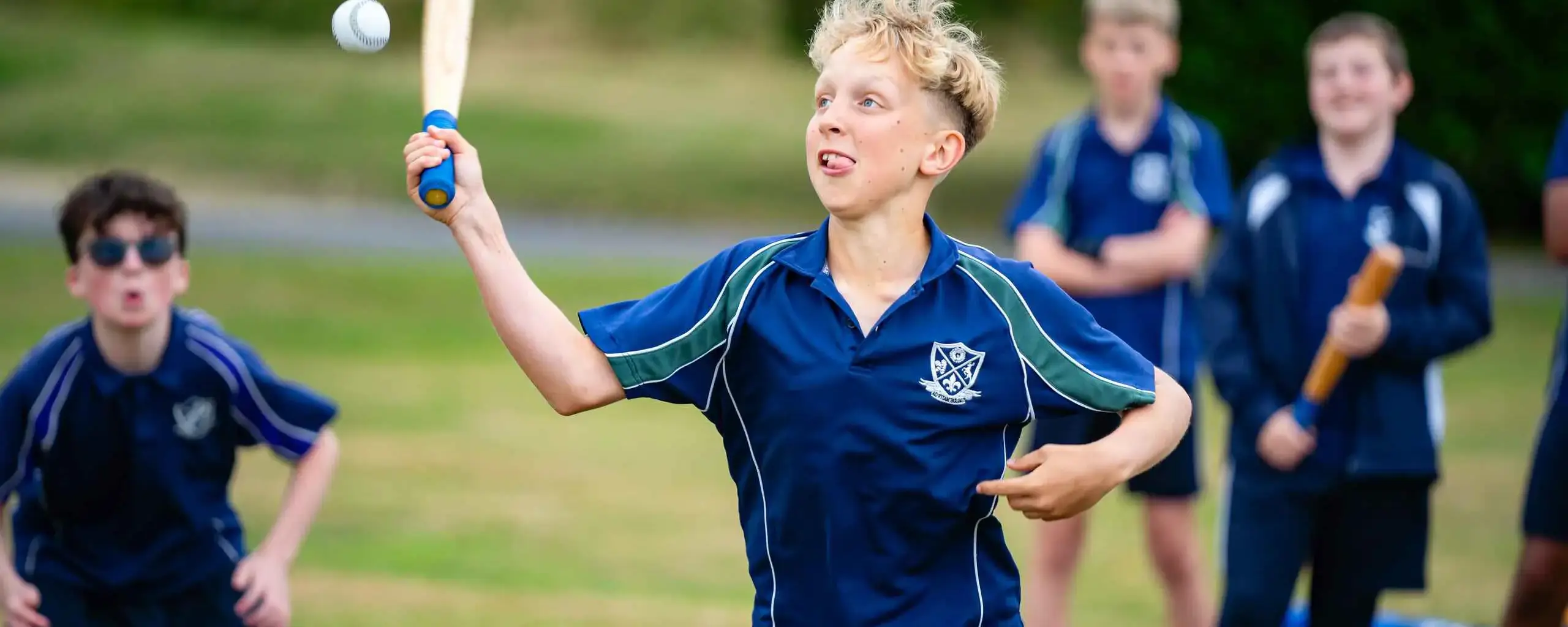 Student Playing Rounders during PE Sport Games Lesson