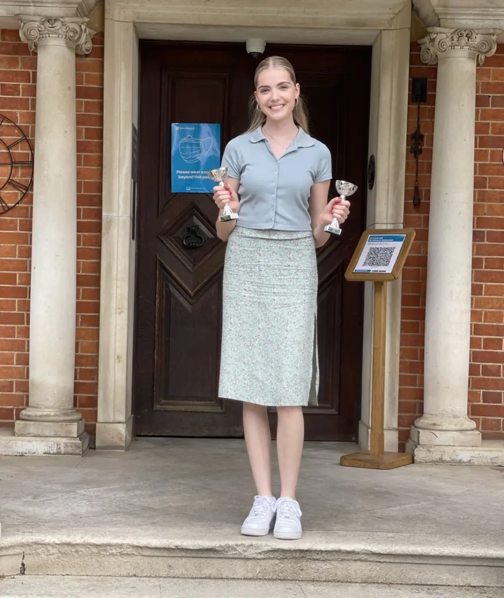 Student standing in front of doorway