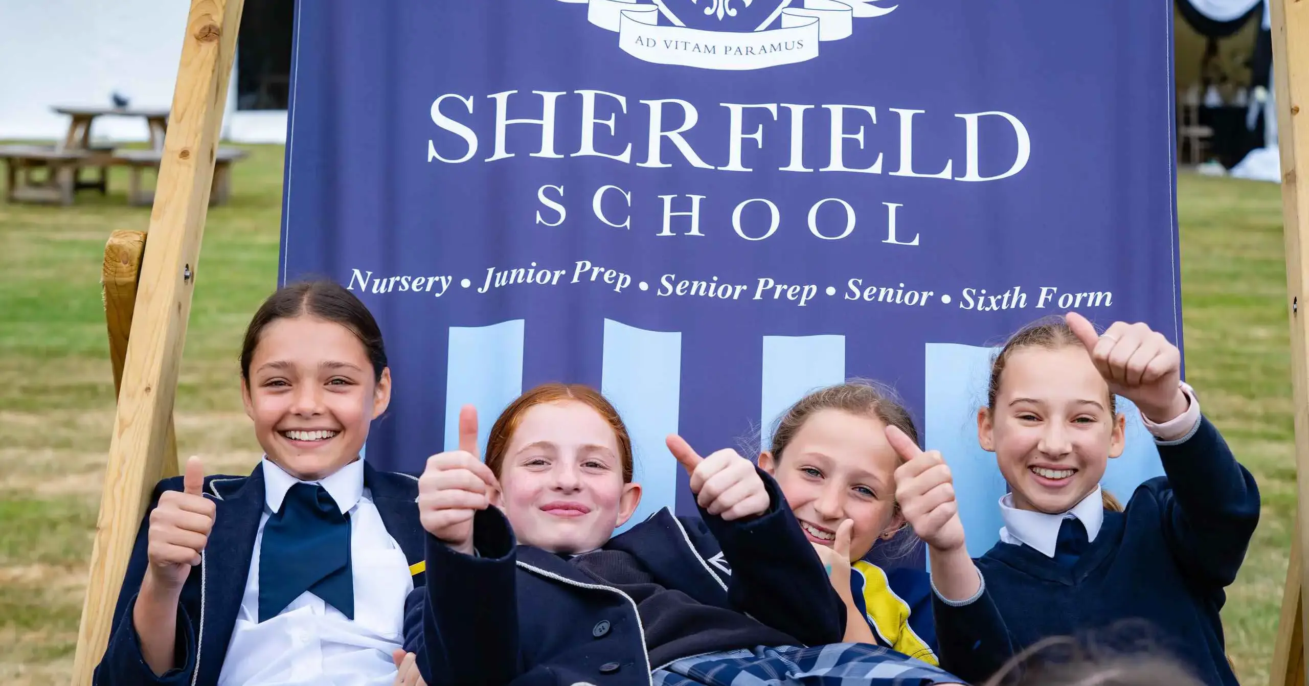 Prep students smiling from a large deck chair