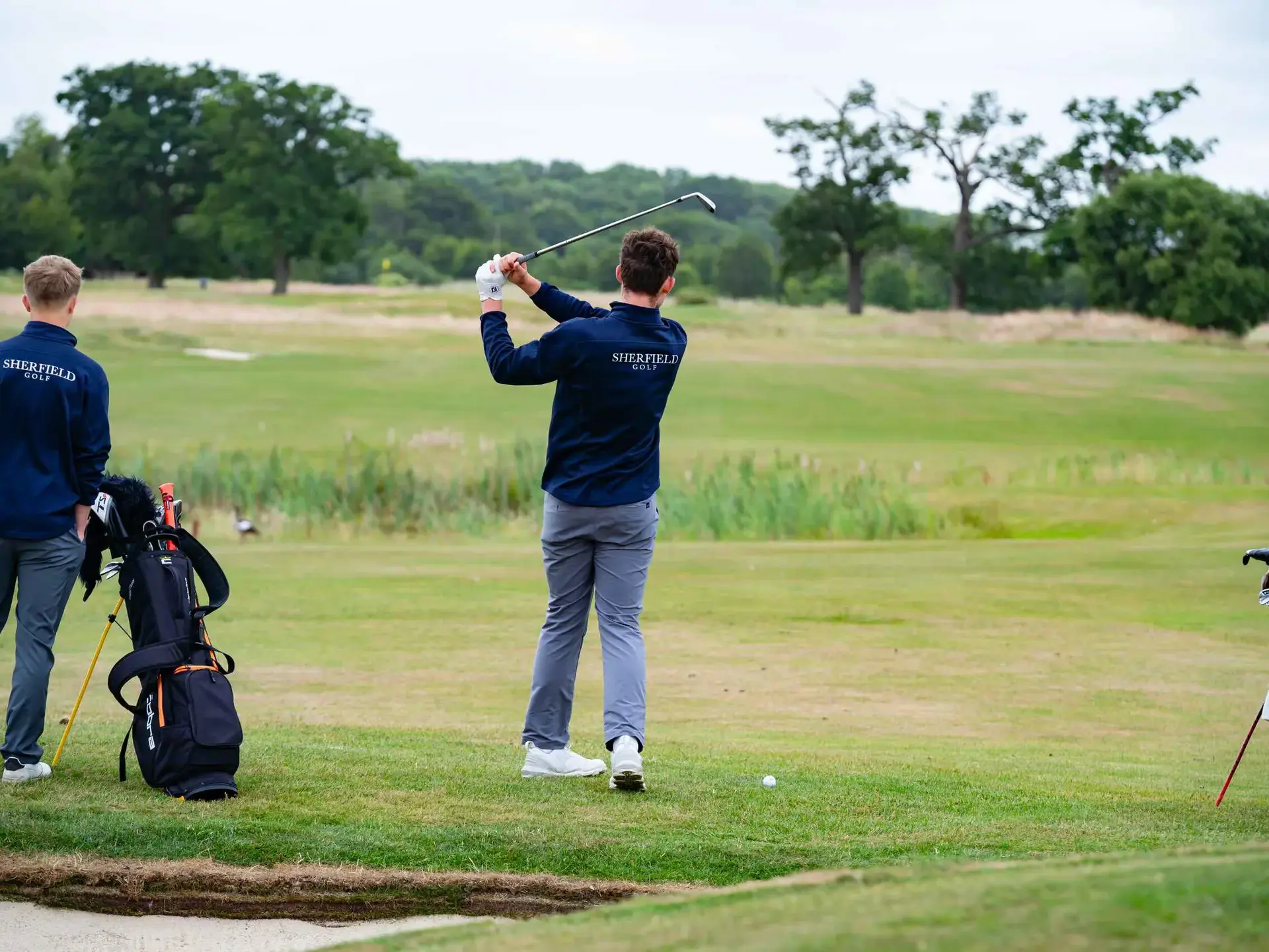 Student playing golf